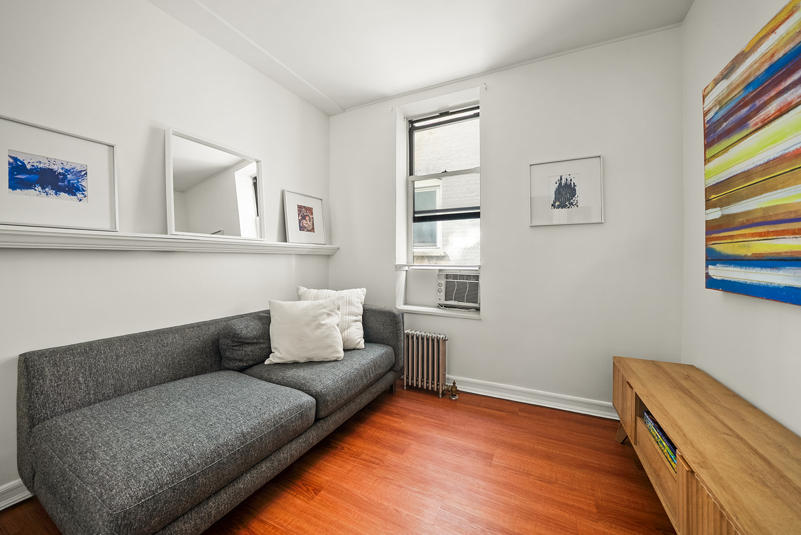 364 West 121st Street, Unit 4A Manhattan, NY 10027 - Photo 9 of 12 a living room with furniture and a window