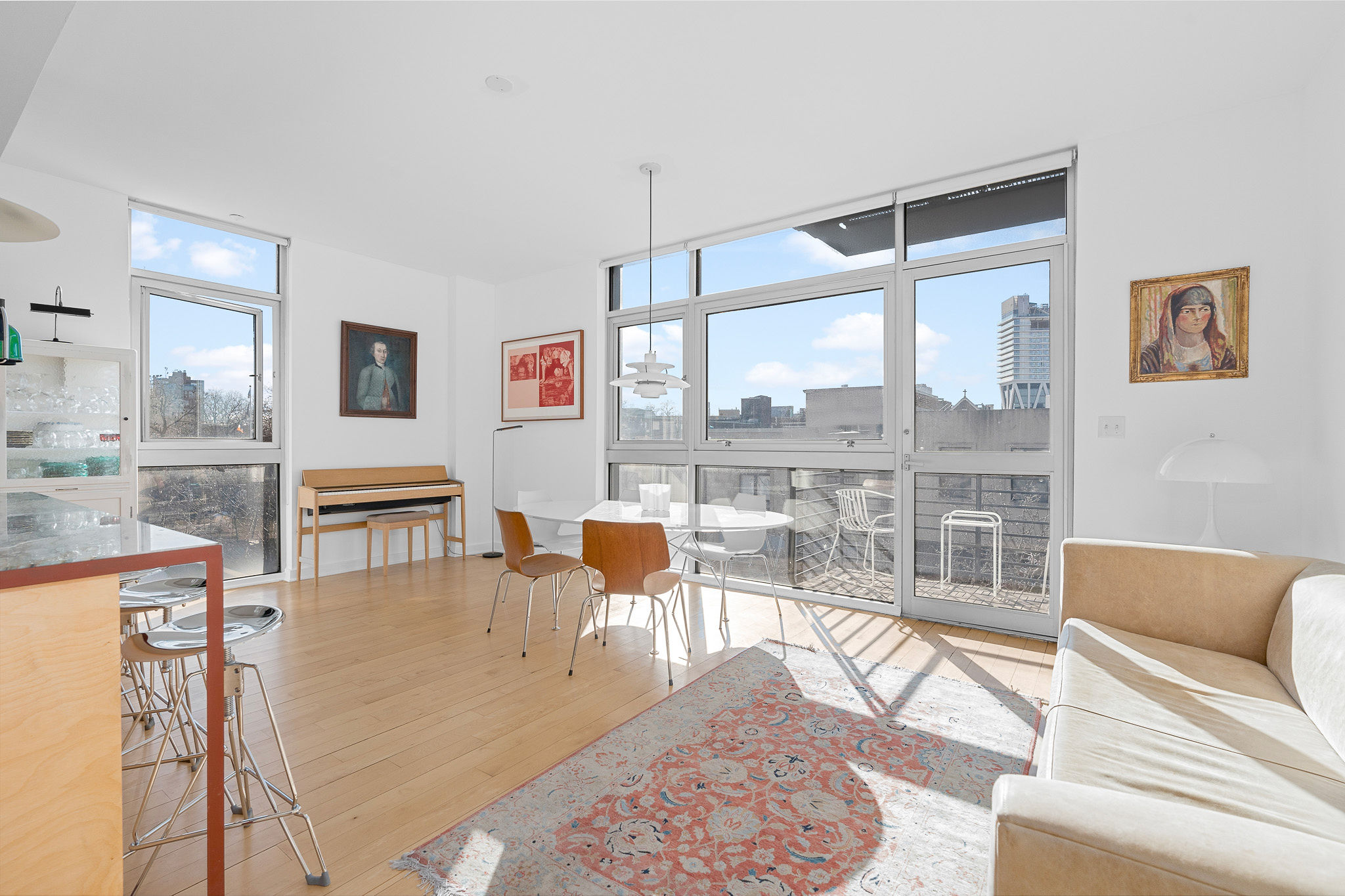 82 Guernsey Street, Unit 3B Brooklyn, NY 11222 - Photo 6 of 18 a living room with furniture a rug and a large window
