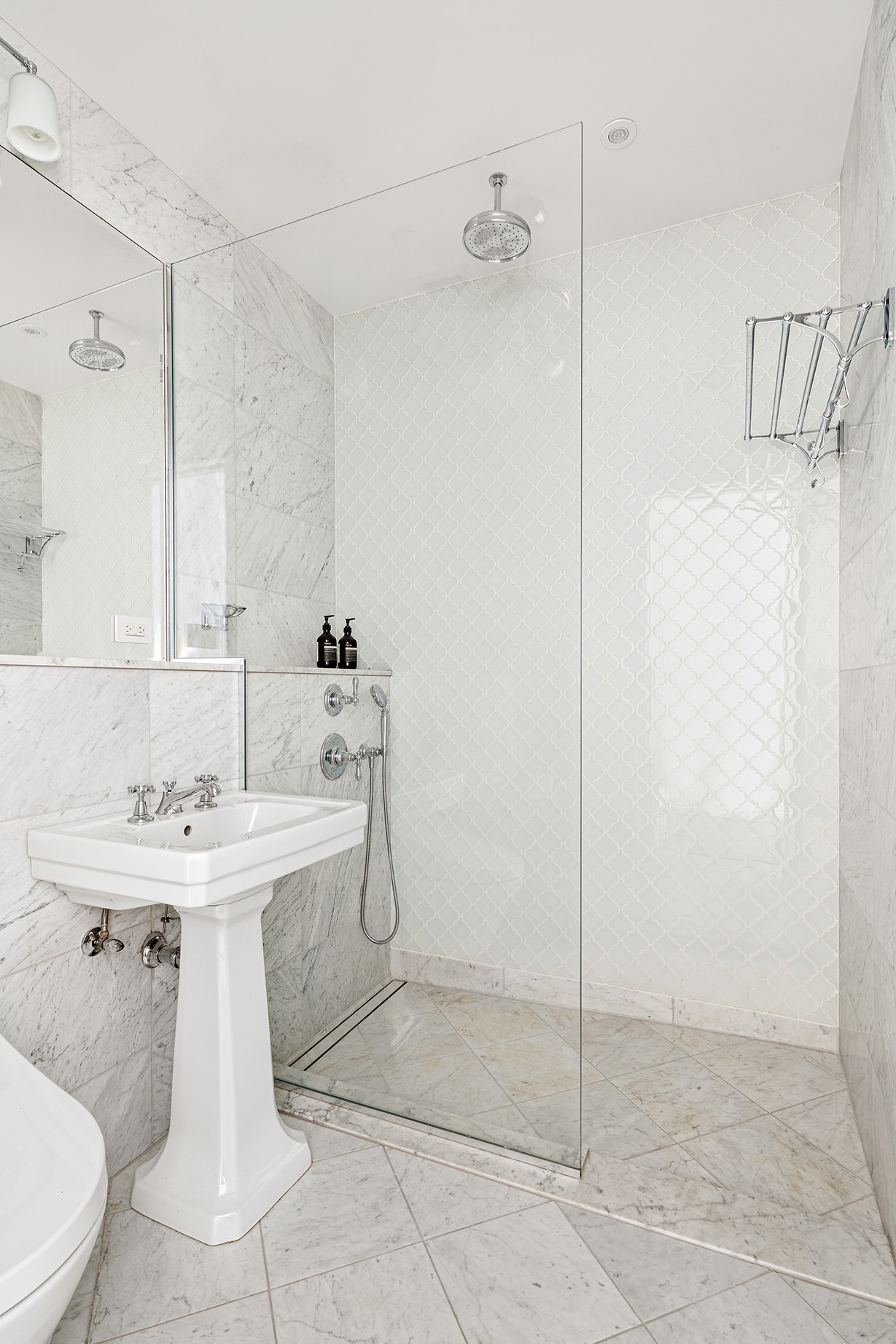 73 Wooster Street, Unit PHA Manhattan, NY 10012 - Photo 17 of 25 a bathroom with a sink toilet and shower