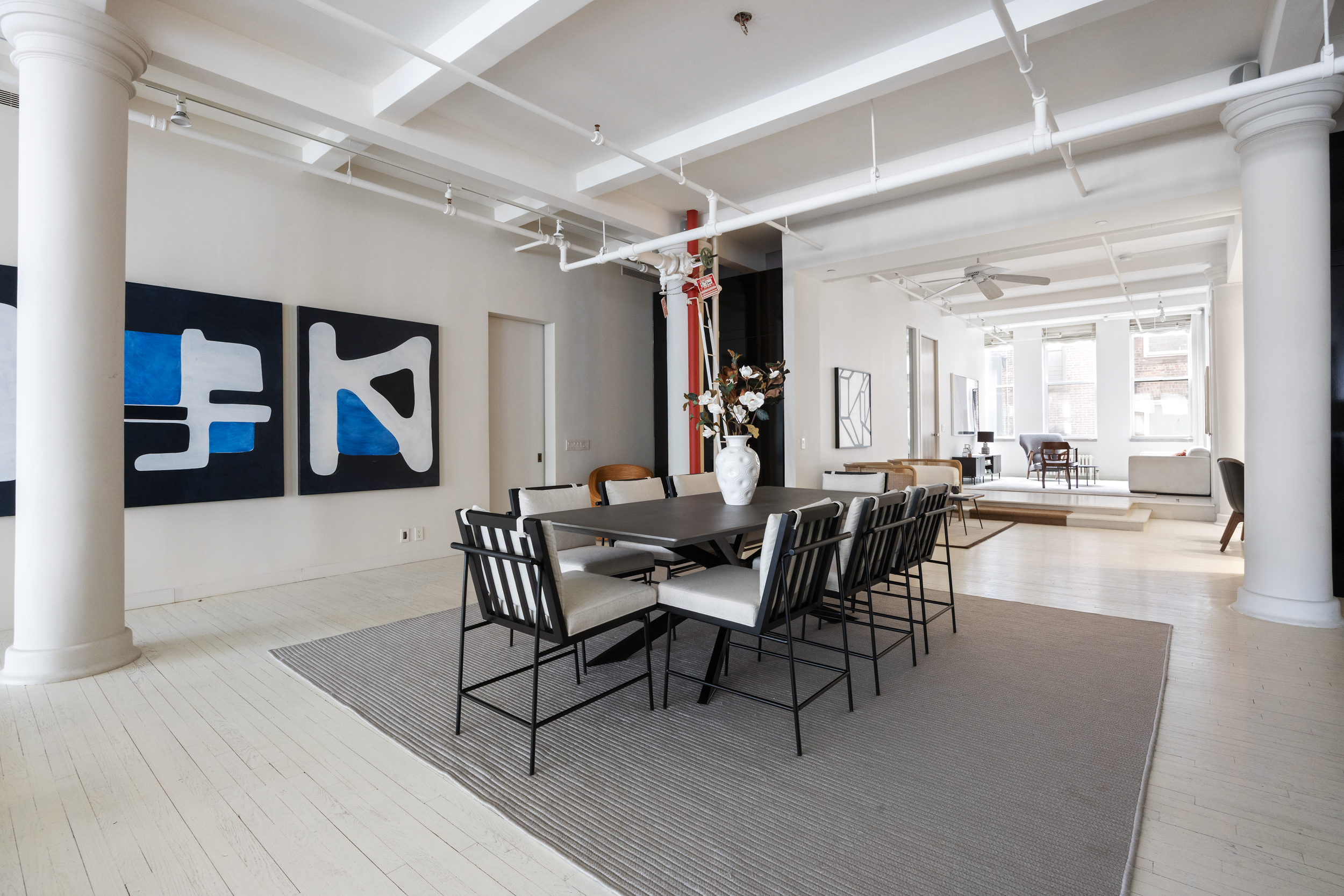 32 West 20th Street, Unit 5 Manhattan, NY 10011 - Photo 5 of 18 a view of a dining room with furniture and wooden floor