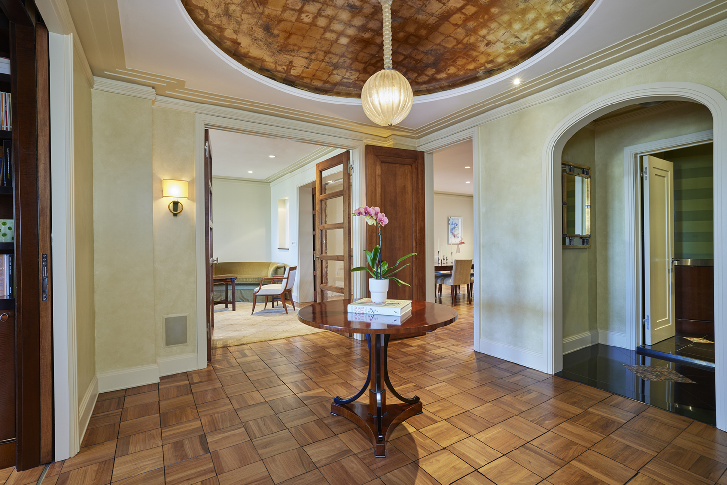 115 Central Park West, Unit 18JK Manhattan, NY 10023 - Photo 4 of 25 a view of a hallway with dining area and chandelier