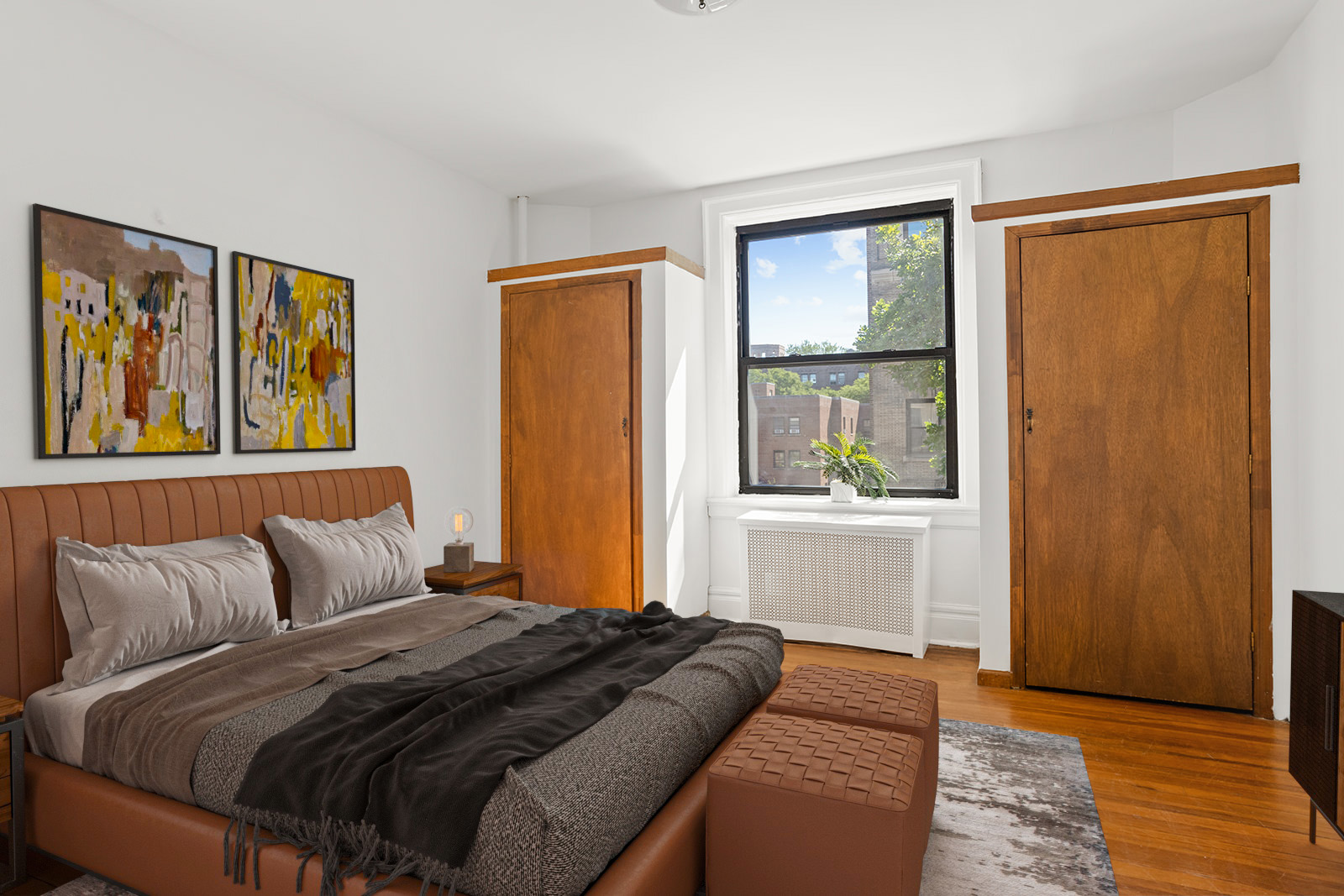 35-30 82nd Street, Unit 32 Queens, NY 11372 - Photo 5 of 11 a bedroom with a bed and a window