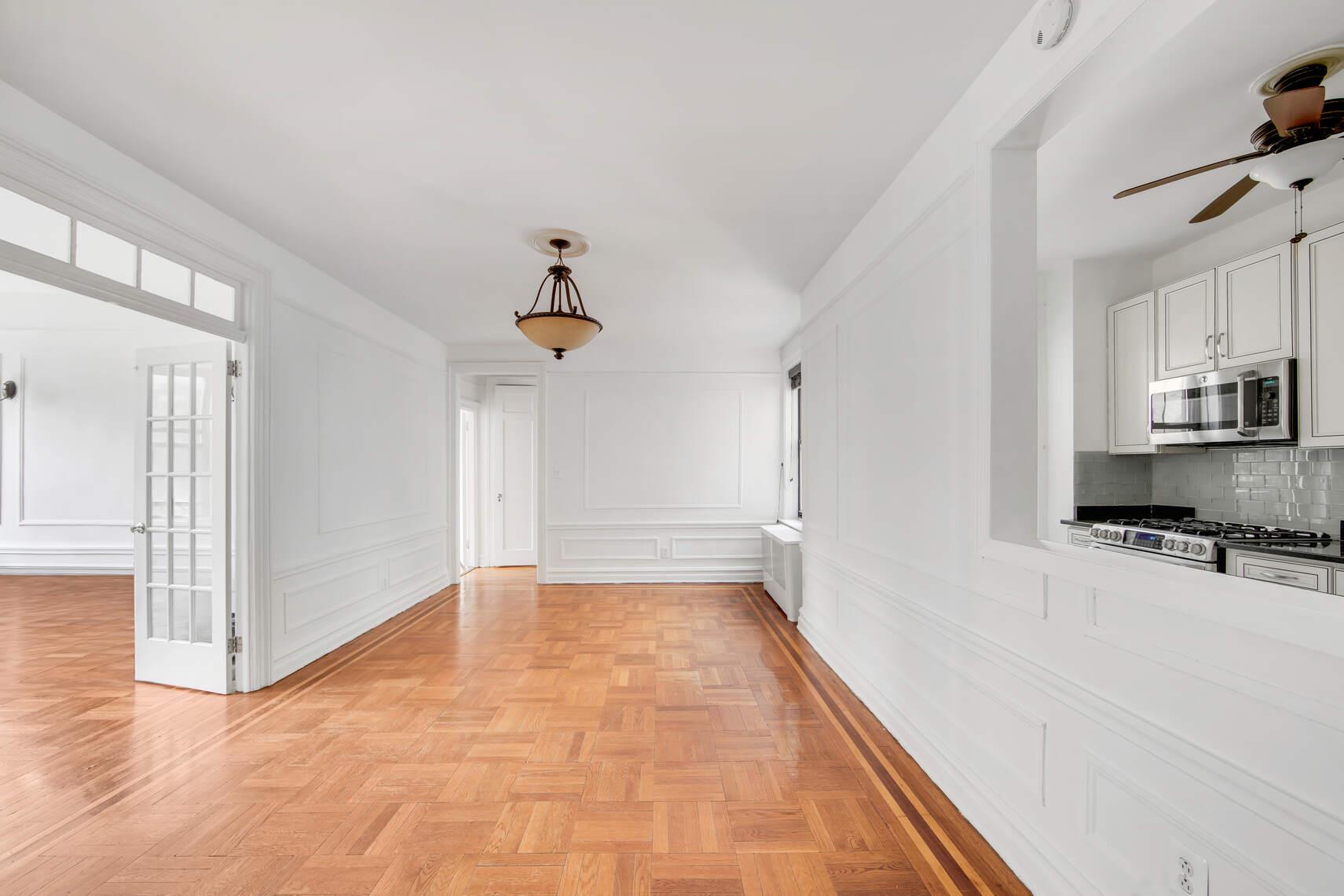 a view of a kitchen with a stove and cabinets