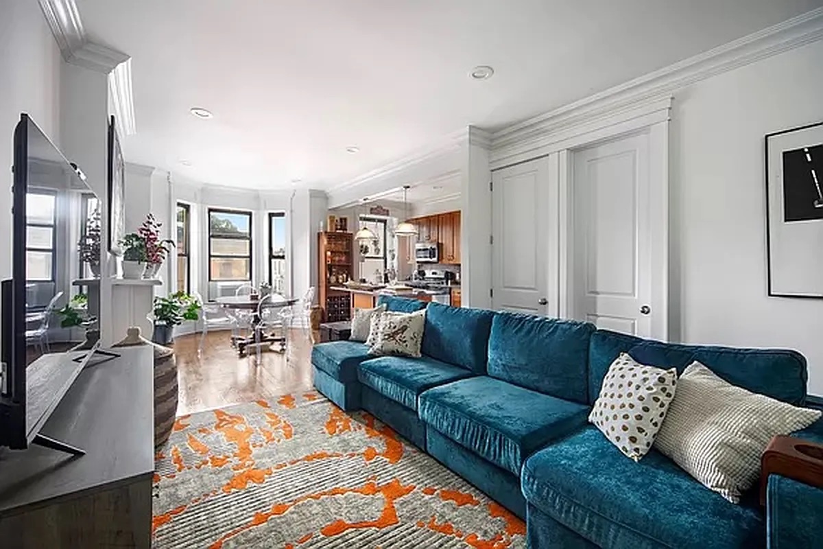 320 7th Avenue, Unit 1 Brooklyn, NY 11215 - Photo 1 of 7 a living room with furniture wooden floor and a chandelier