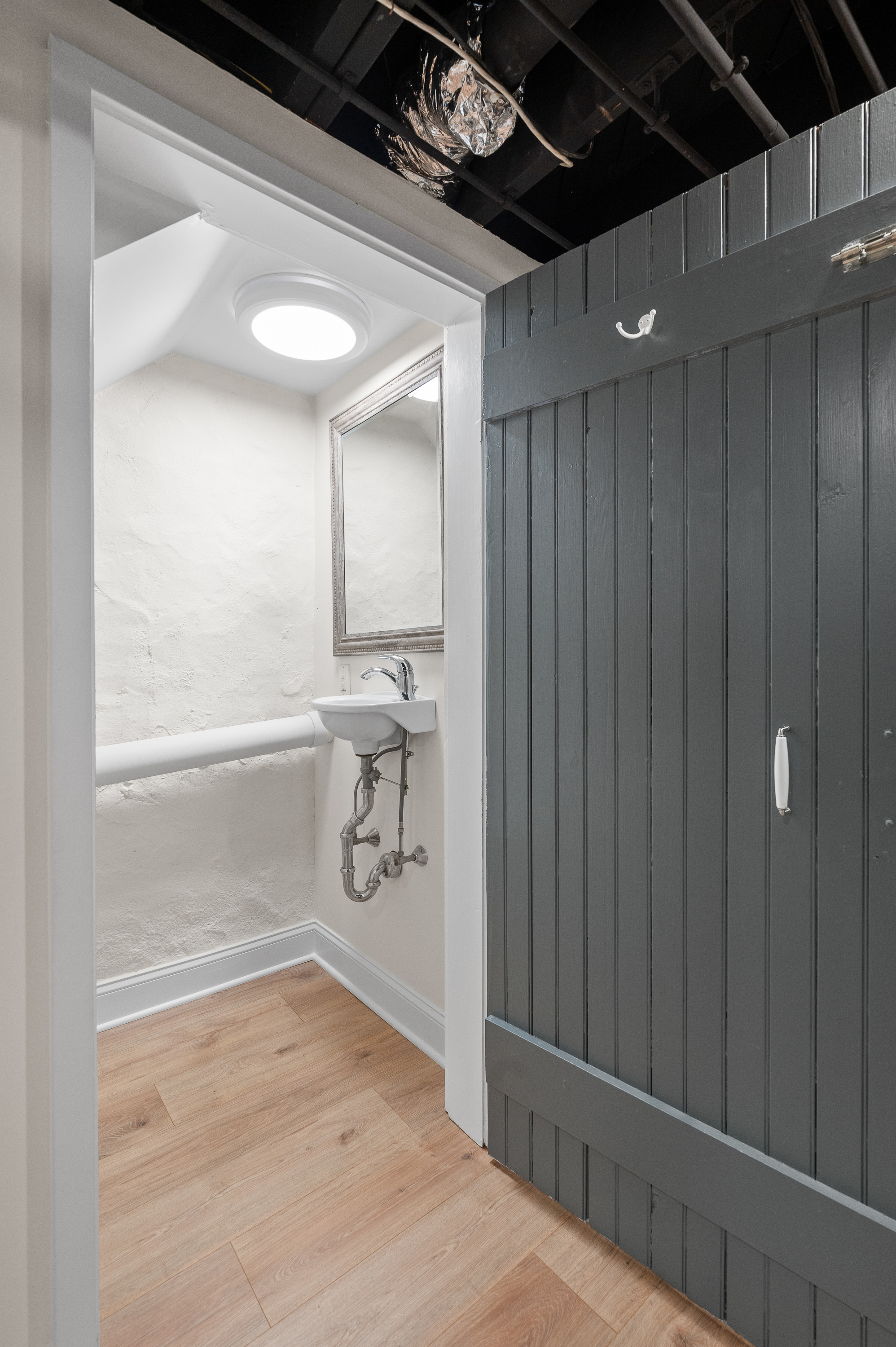 201 West Avenue Wayne, PA 19087 - Photo 19 of 26 a bathroom with a granite countertop sink and a mirror