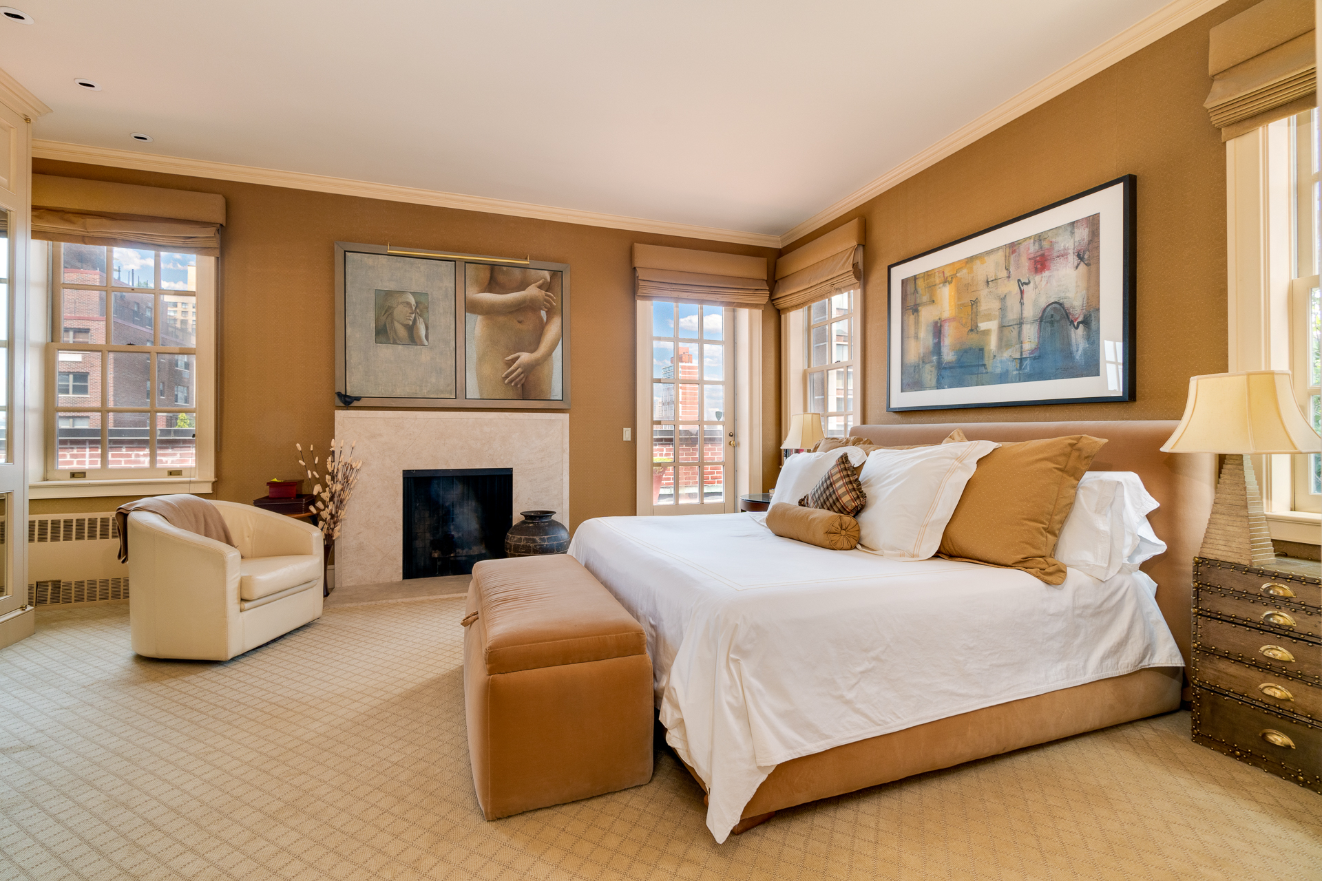 340 East 72nd Street, Unit PH Manhattan, NY 10021 - Photo 5 of 12 a bedroom with a bed and a couch