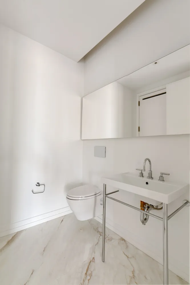 a bathroom with a sink toilet and vanity
