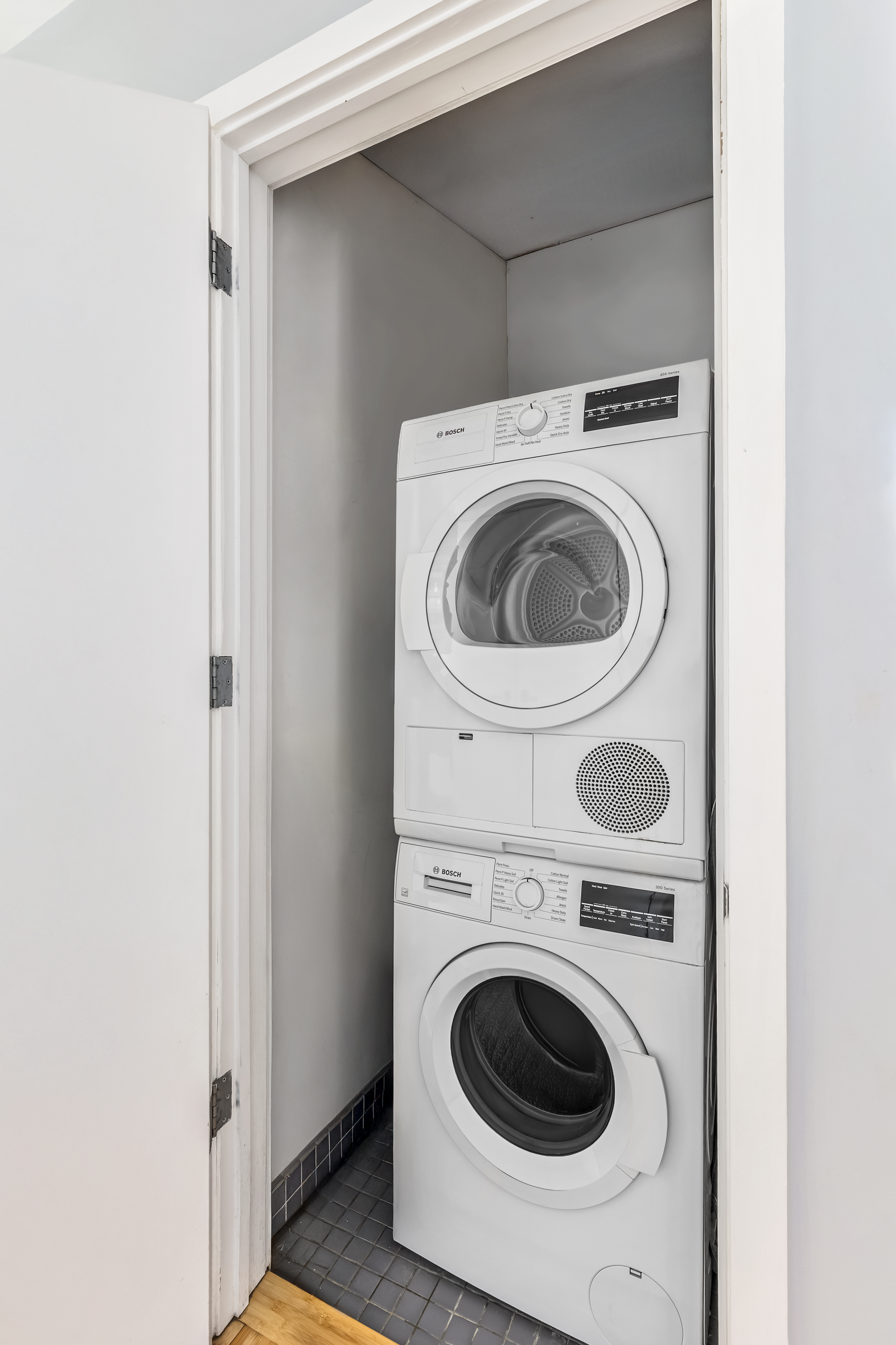 105 Norfolk Street, Unit 10A Manhattan, NY 10002 - Photo 8 of 11 a utility room with dryer and washer