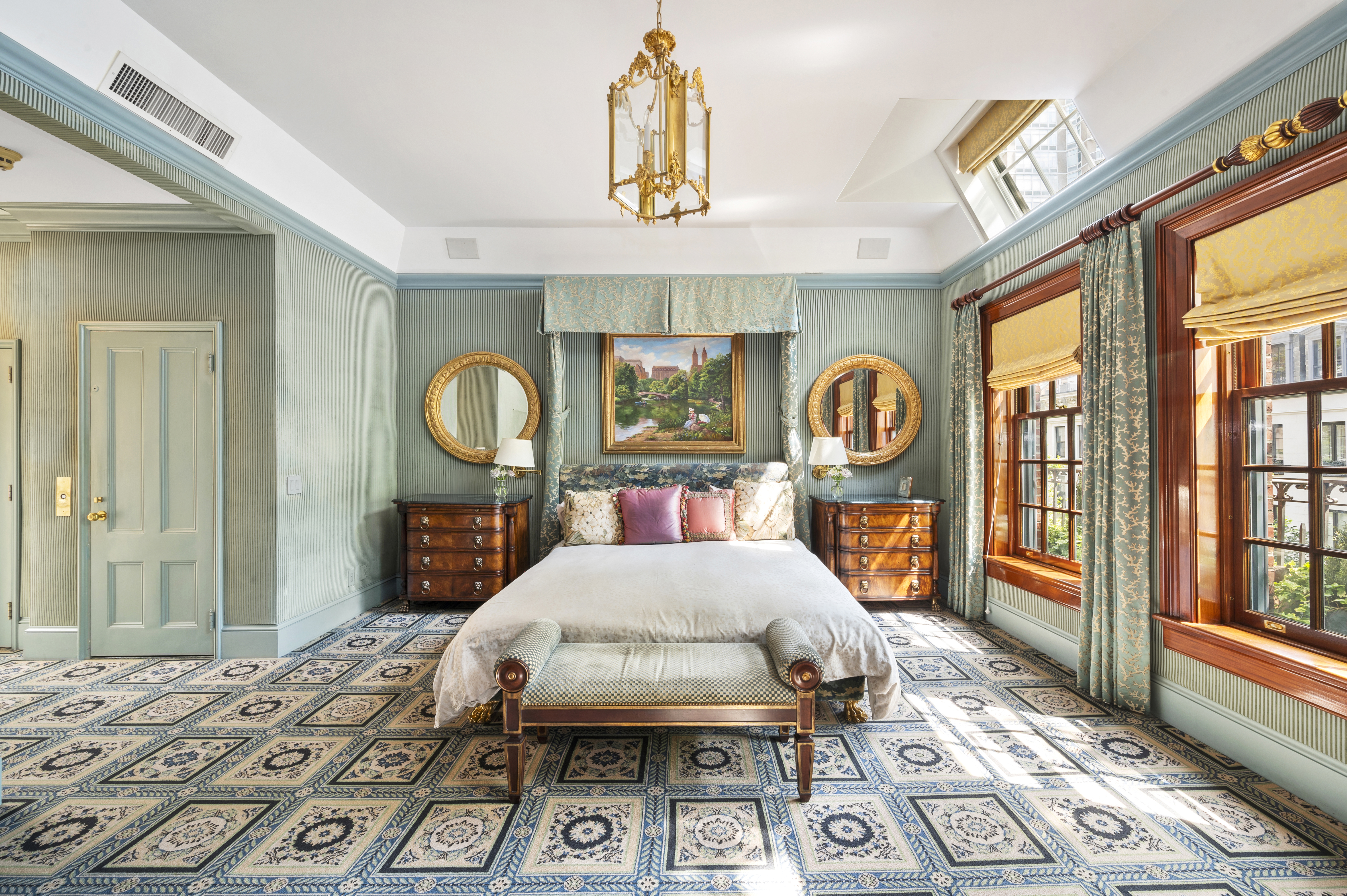 163 East 64th Street Manhattan, NY 10065 - Photo 31 of 34 a bedroom with a bed a mirror on dresser and a large window