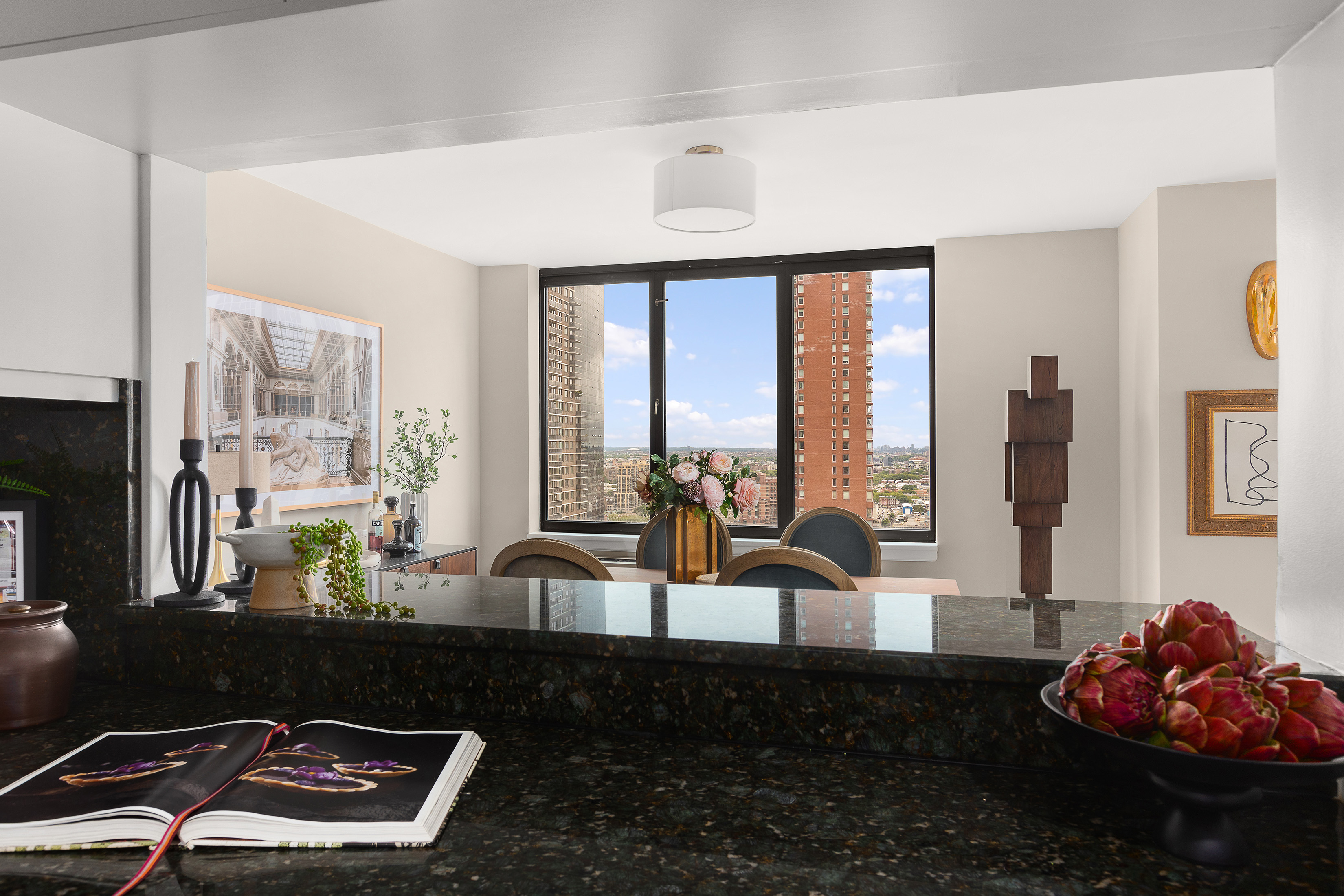 422 East 72nd Street, Unit 27C Manhattan, NY 10021 - Photo 9 of 25 a living room with furniture and floor to ceiling windows