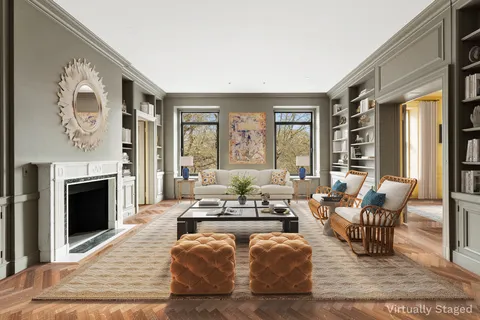 a living room with fireplace furniture and a fireplace