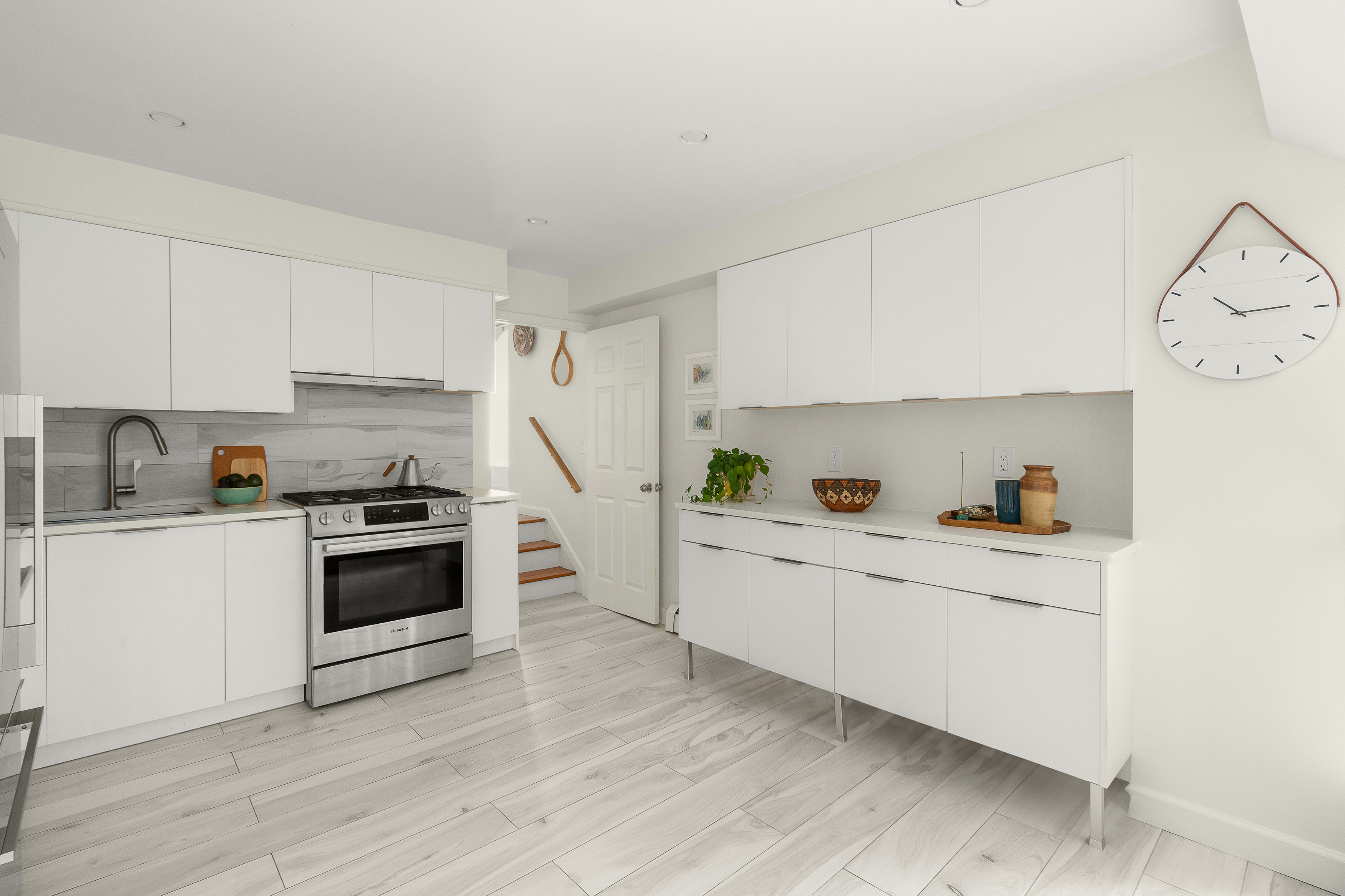 450 Clinton Street, Unit 4B Brooklyn, NY 11231 - Photo 3 of 7 a kitchen with white cabinets and white appliances