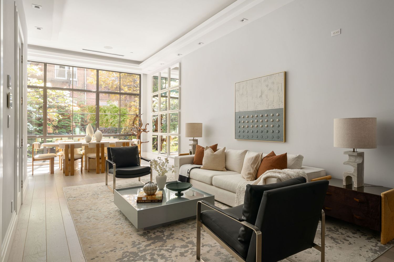 520 East 89th Street Manhattan, NY 10128 - Photo 4 of 40 a living room with furniture and a large window