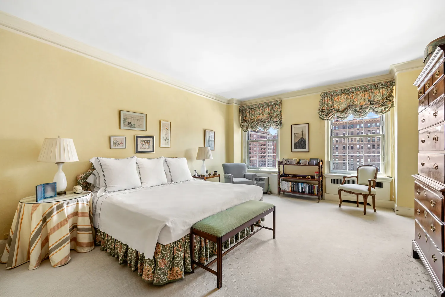 a spacious bedroom with a bed and a couch