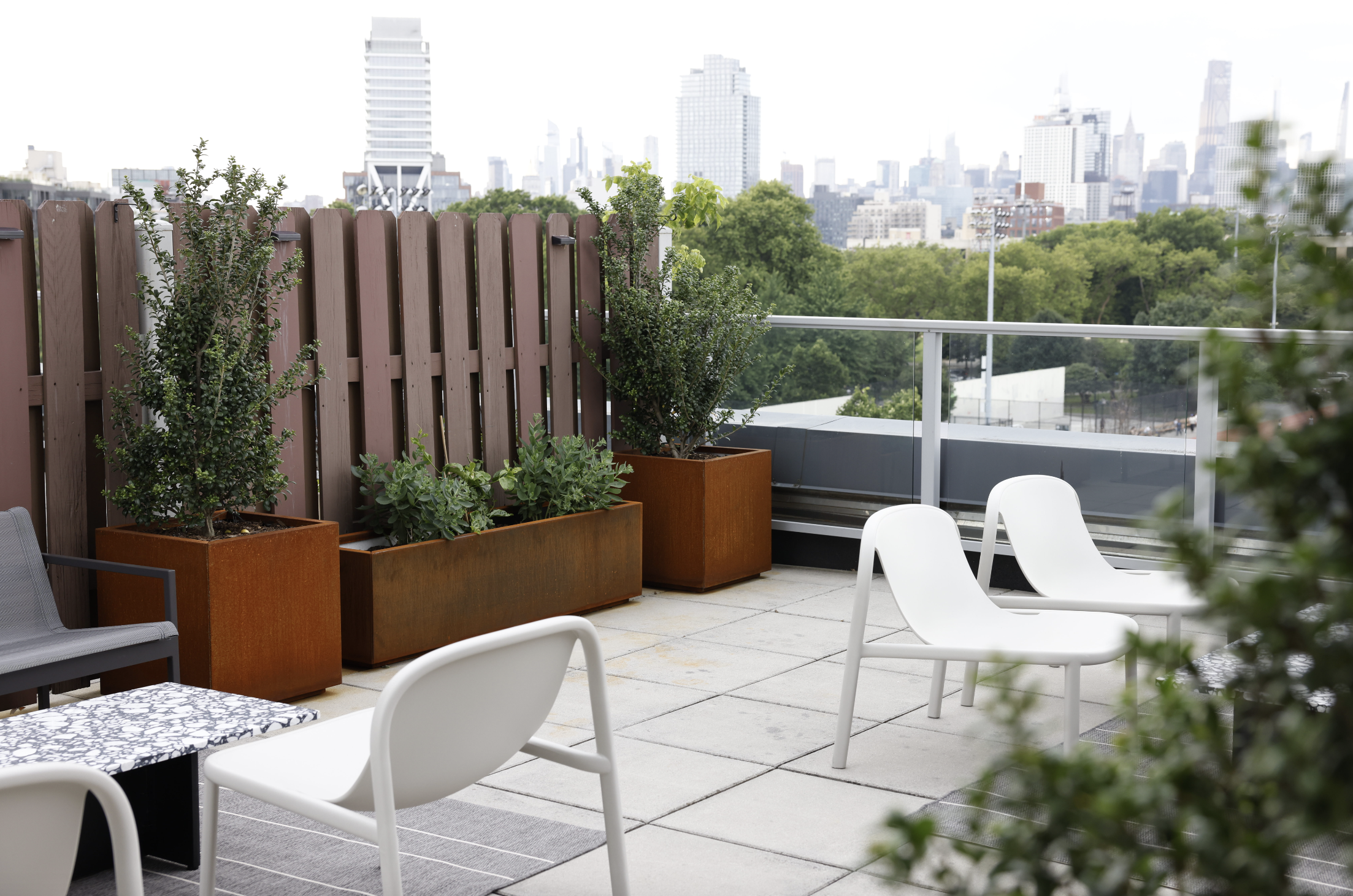 50 Bayard Street, Unit 1B Brooklyn, NY 11211 - Photo 10 of 13 a view of a chairs and table in the back yard of the house