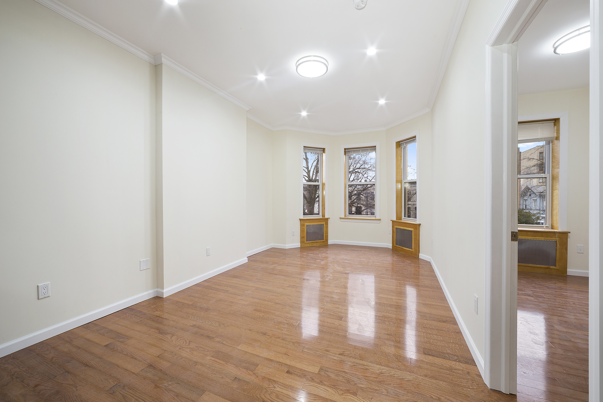 208 Lenox Road, Unit 3 Brooklyn, NY 11226 - Photo 3 of 7 a view of an empty room and window