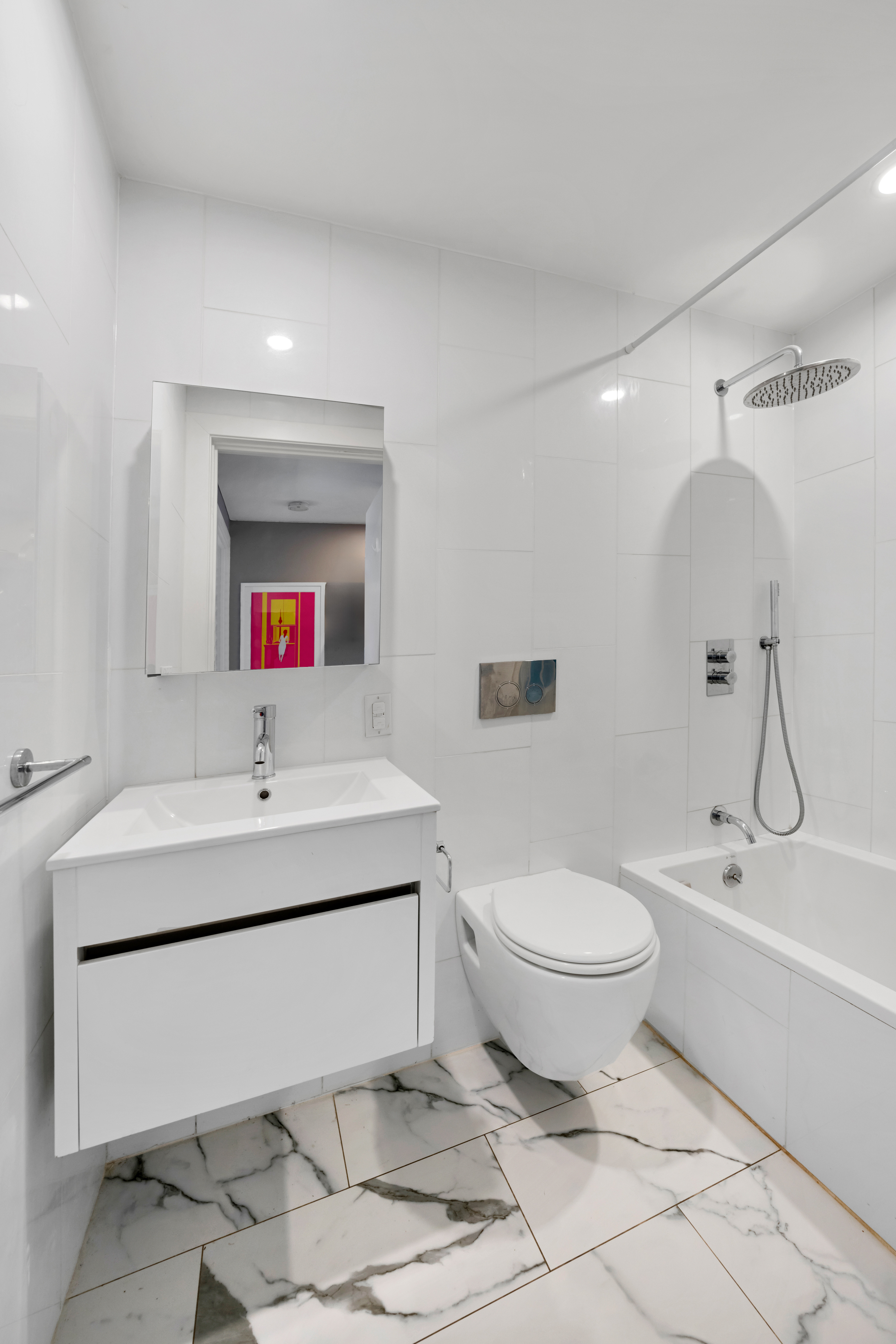 316 Carroll Street, Unit 2 Brooklyn, NY 11231 - Photo 8 of 12 a bathroom with a sink toilet a mirror and vanity