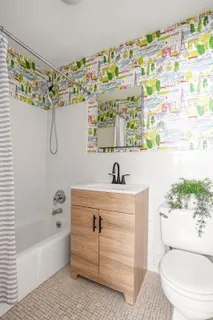 a bathroom with a sink a toilet and a bathtub