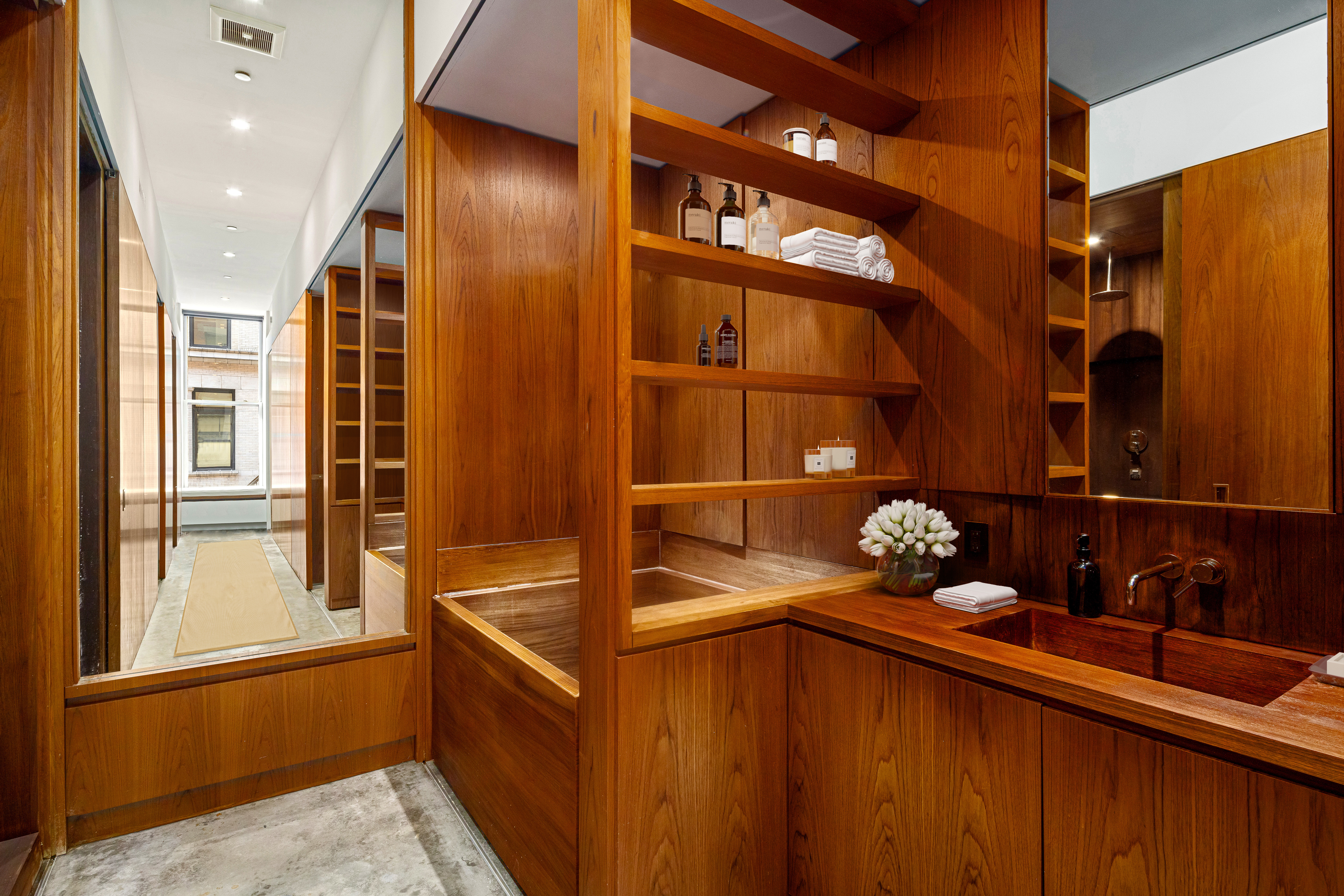 76 Crosby Street, Unit 2B Manhattan, NY 10012 - Photo 9 of 17 a bathroom with a sink and a mirror
