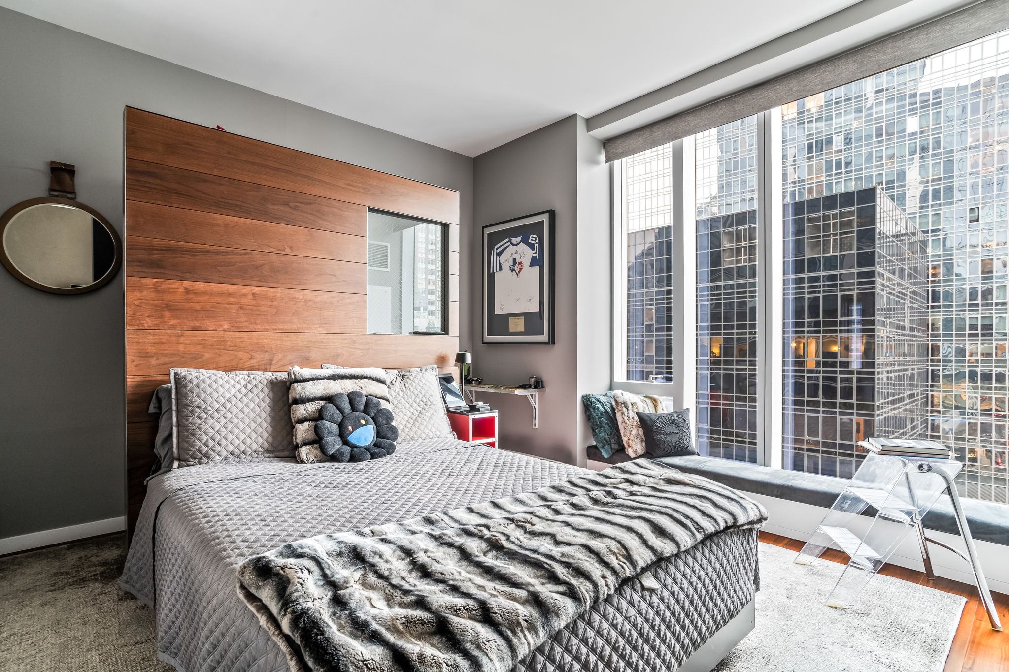 1 West End Avenue, Unit 9D Manhattan, NY 10023 - Photo 13 of 22 a bedroom with a large bed and a large window