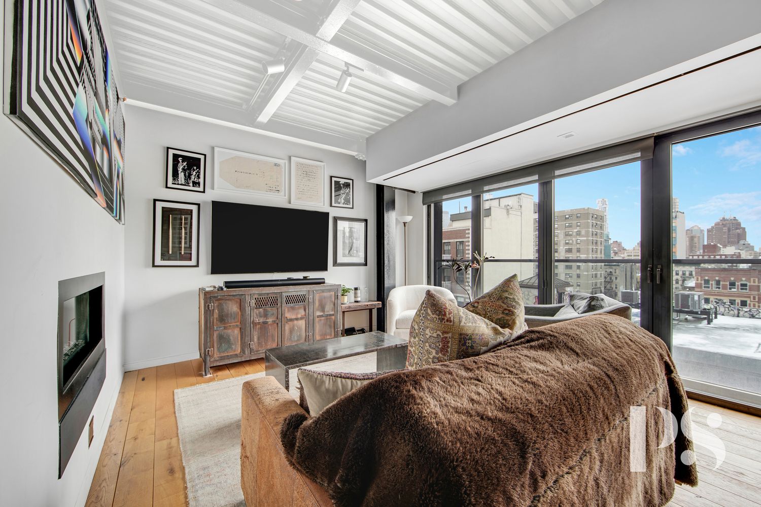 a living room with a large window and a flat screen tv