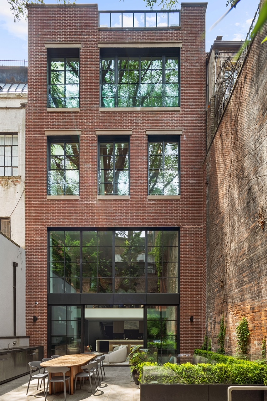 17 East 9th Street Manhattan, NY 10003 - Photo 8 of 32 a front view of a building with large windows and glass windows