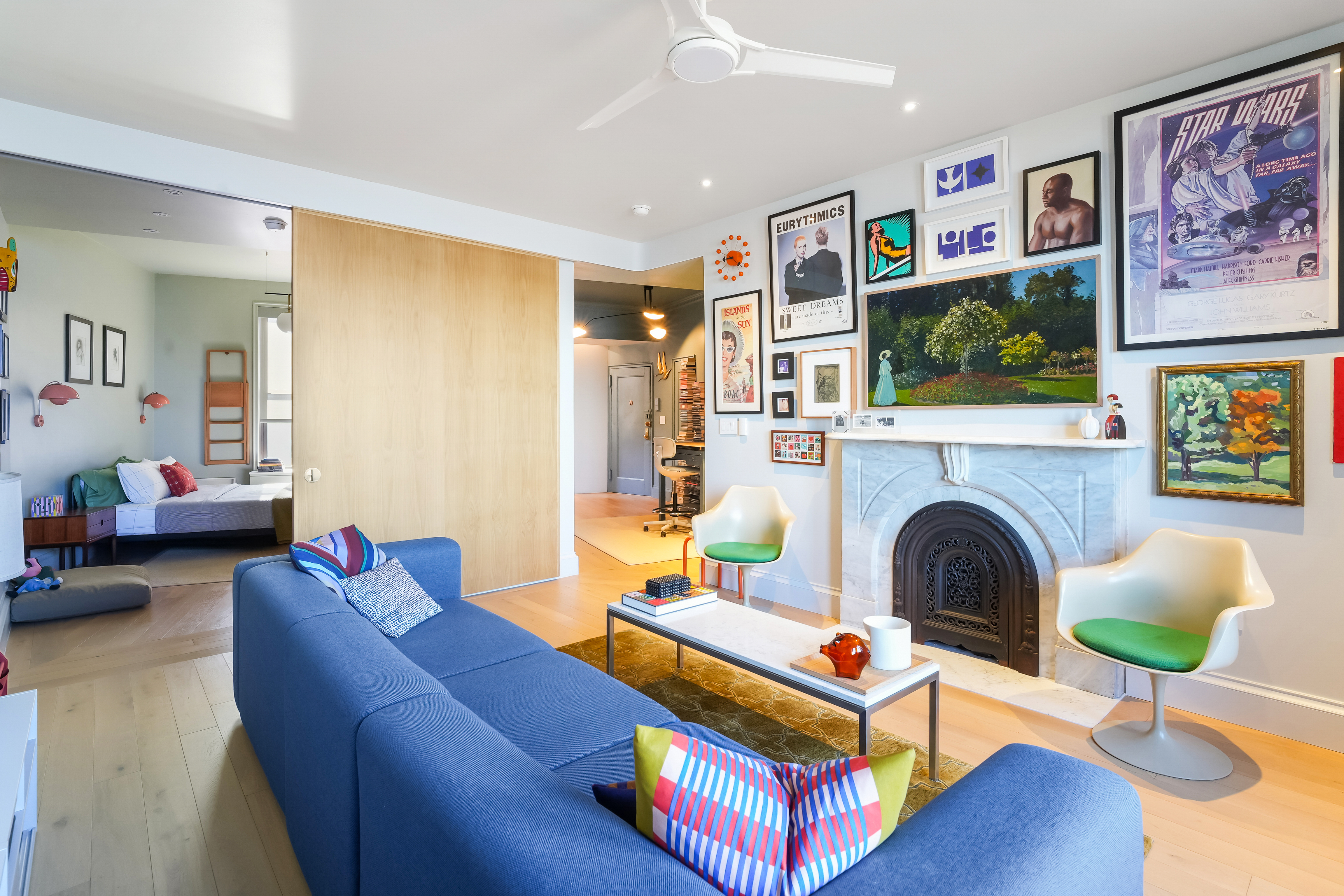 265 Riverside Drive, Unit 11F Manhattan, NY 10025 - Photo 4 of 18 a living room with furniture a flat screen tv and a fireplace