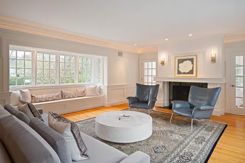 a living room with furniture and a rug