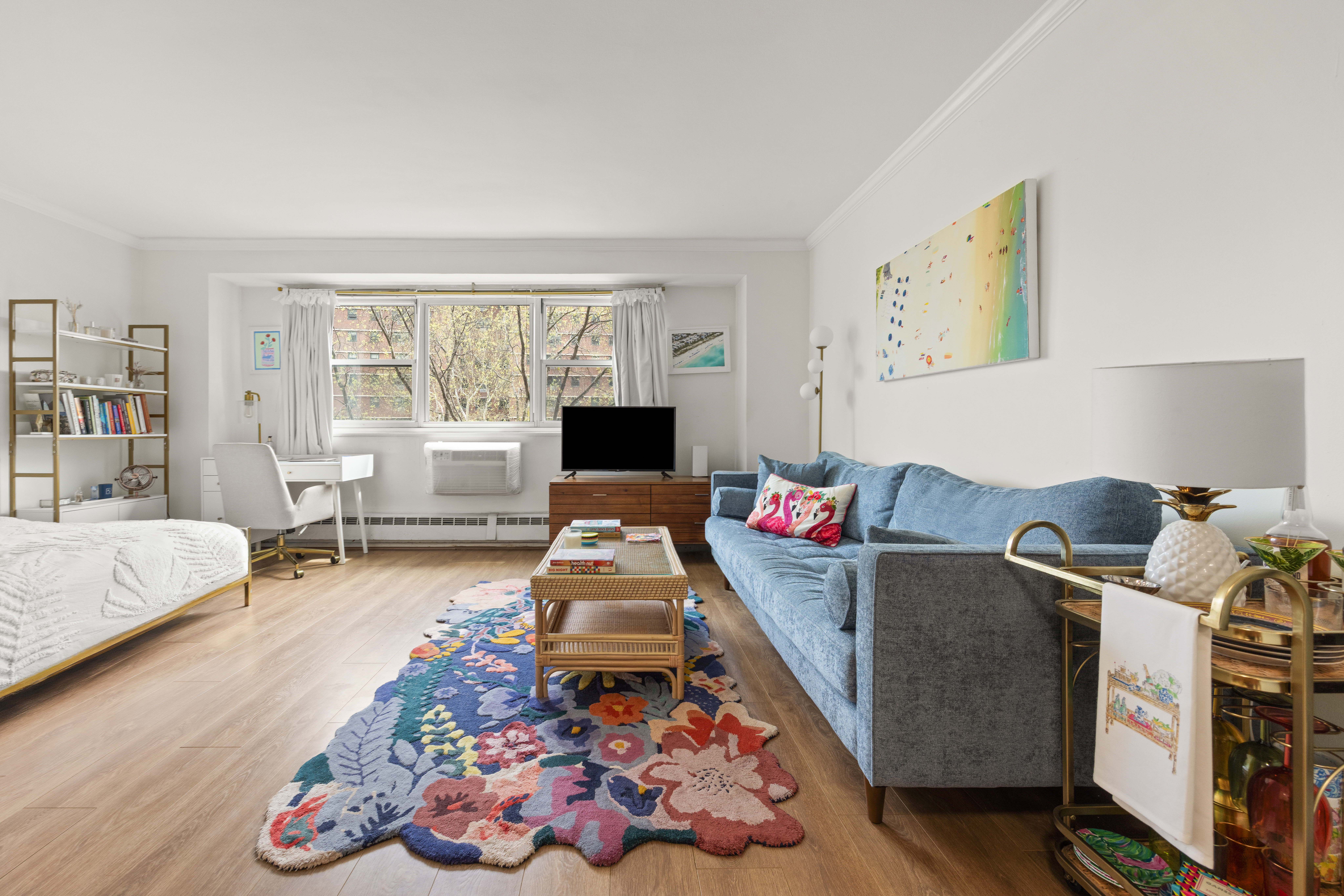 191 Willoughby Street, Unit 5E Brooklyn, NY 11201 - Photo 2 of 16 a living room with furniture and a flat screen tv