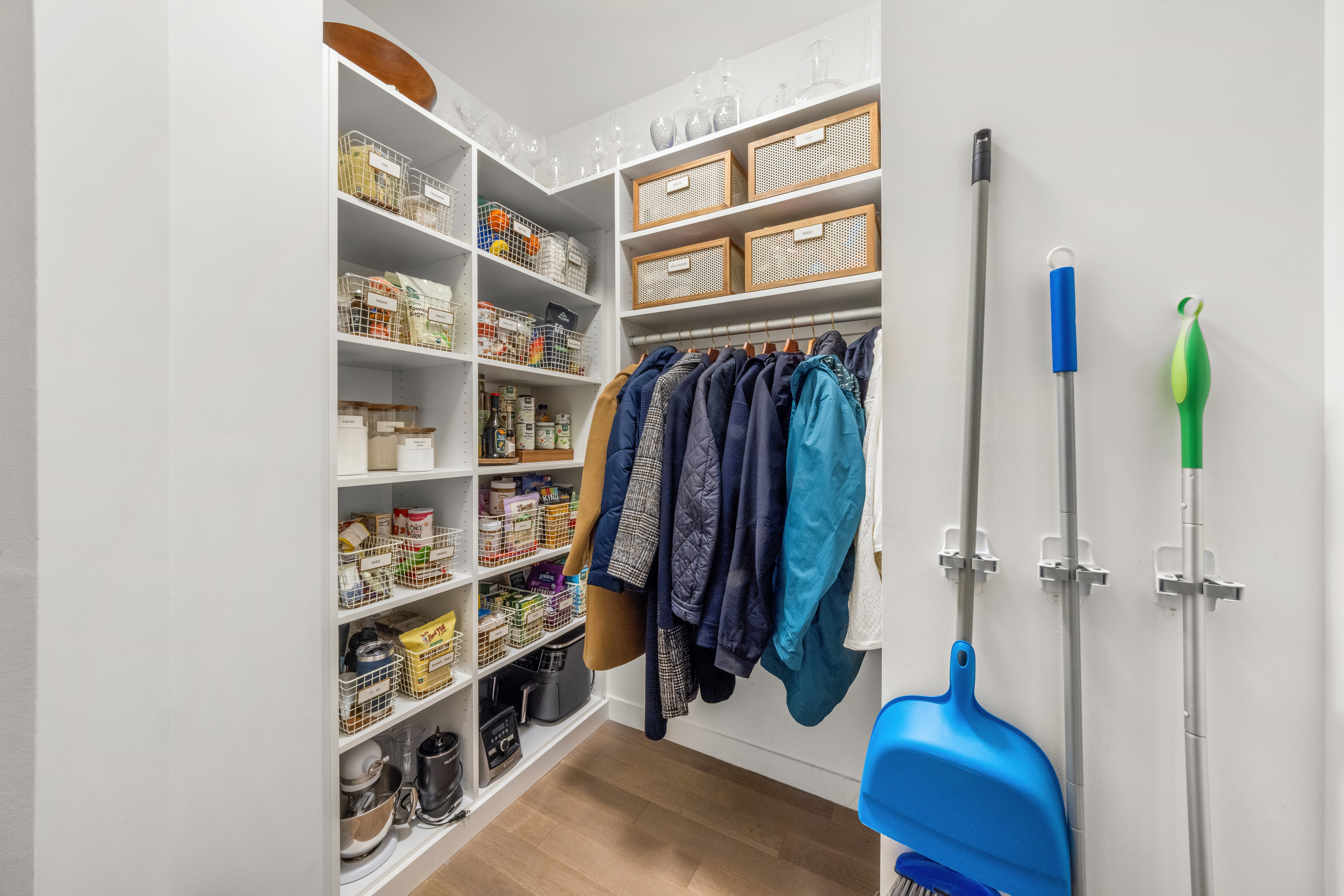 100 Barclay Street, Unit 16H Manhattan, NY 10007 - Photo 11 of 12 a view of walk in closet with clothes and shoes