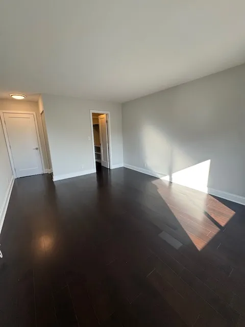 a view of an empty room and window