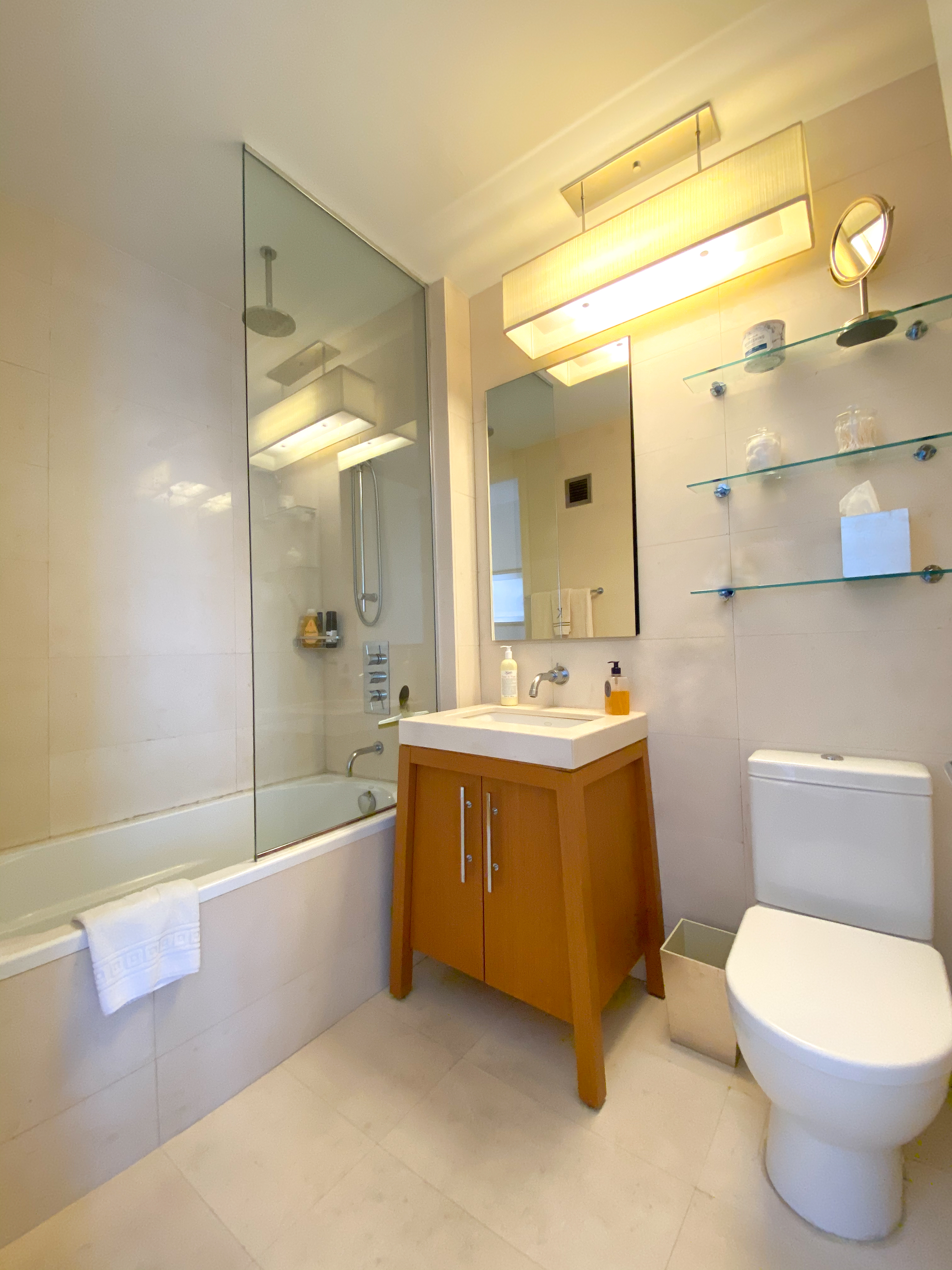 88 Greenwich Street, Unit 3005 Manhattan, NY 10006 - Photo 5 of 7 a bathroom with a sink a toilet and bathtub