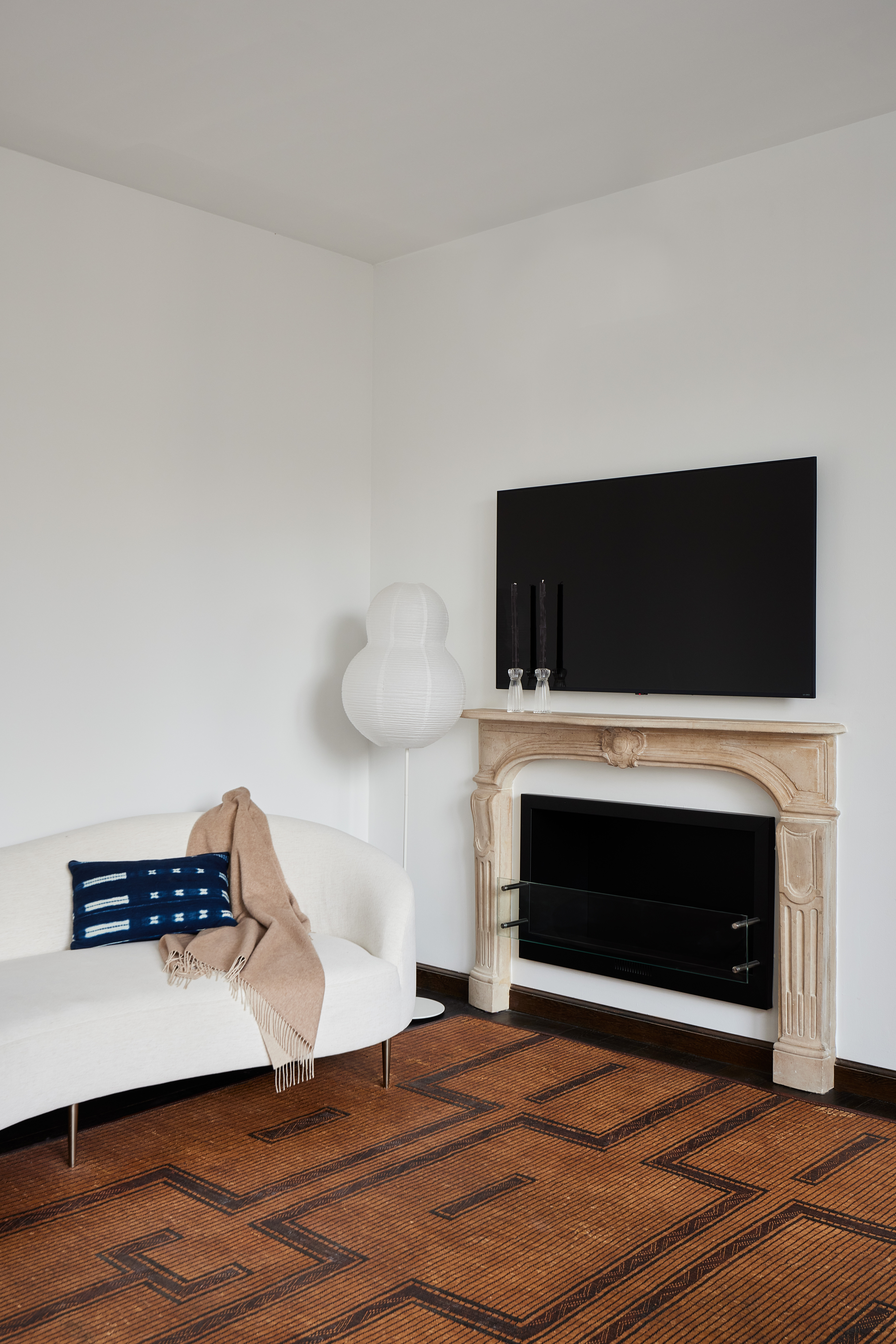 505 Greenwich Street, Unit 14A Manhattan, NY 10013 - Photo 11 of 20 a room with a fireplace and a flat screen tv
