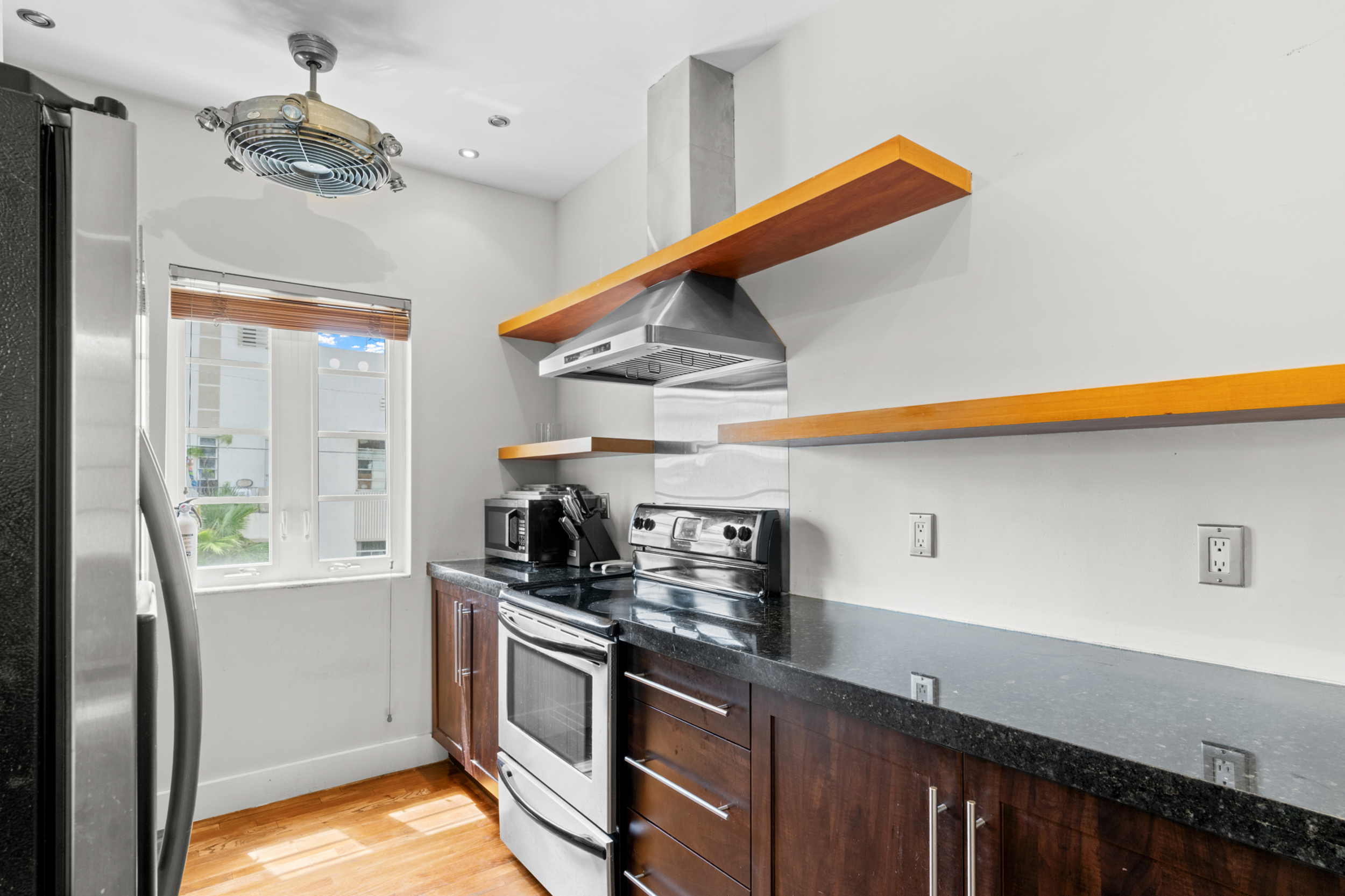 711 East 14th Street, Unit 7 Hialeah, FL 33010 - Photo 17 of 36 a kitchen with stainless steel appliances a sink a stove and a refrigerator