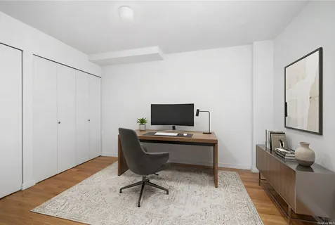 a workspace with furniture and wooden floor