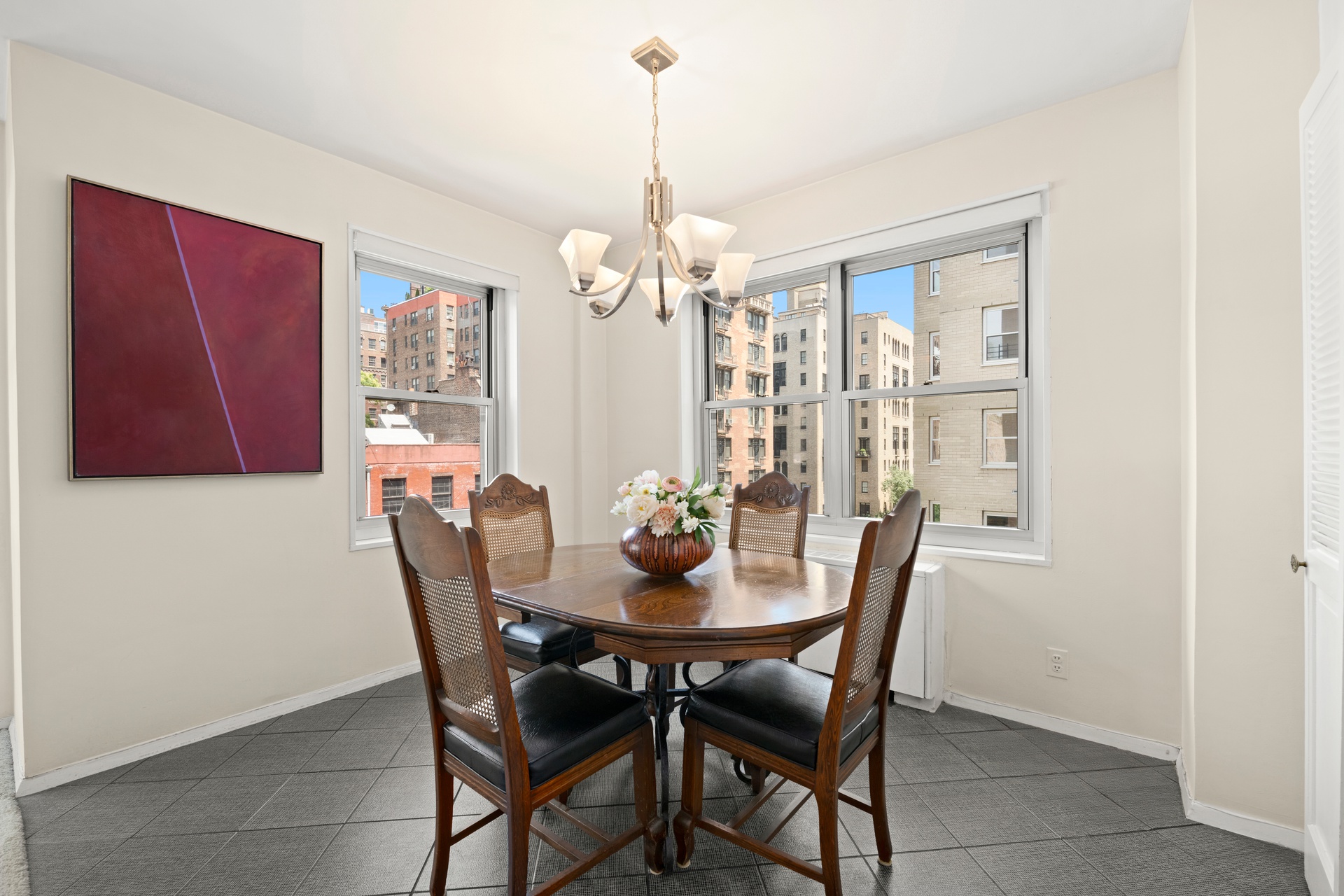 20 East 9th Street, Unit 7V Manhattan, NY 10003 - Photo 6 of 30 a view of a dining room with furniture and chandelier