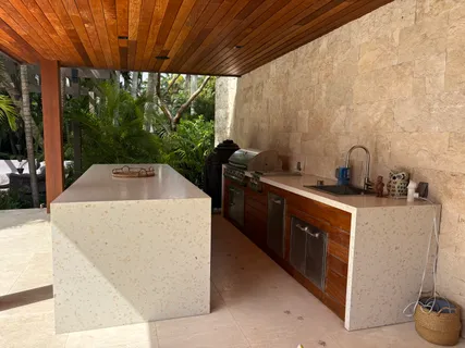 a kitchen with sink a window and a counter top space