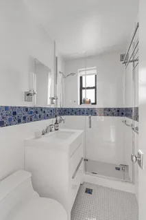 a bathroom with a sink a mirror and a bathtub