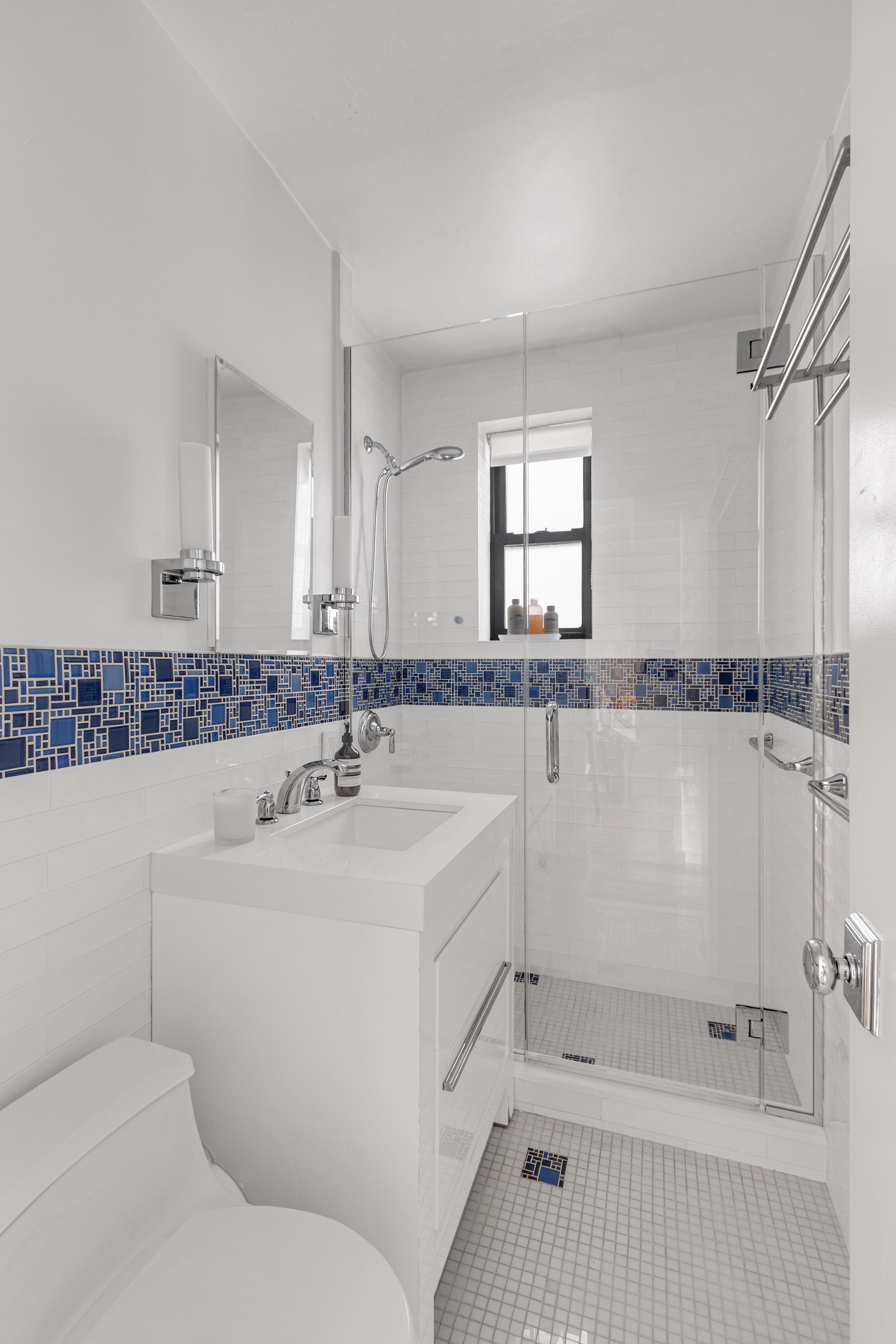 160 West 85th Street, Unit 2J1 Manhattan, NY 10024 - Photo 8 of 12 a bathroom with a sink a mirror and a bathtub