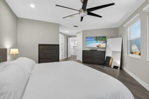 a bedroom with a bed and window