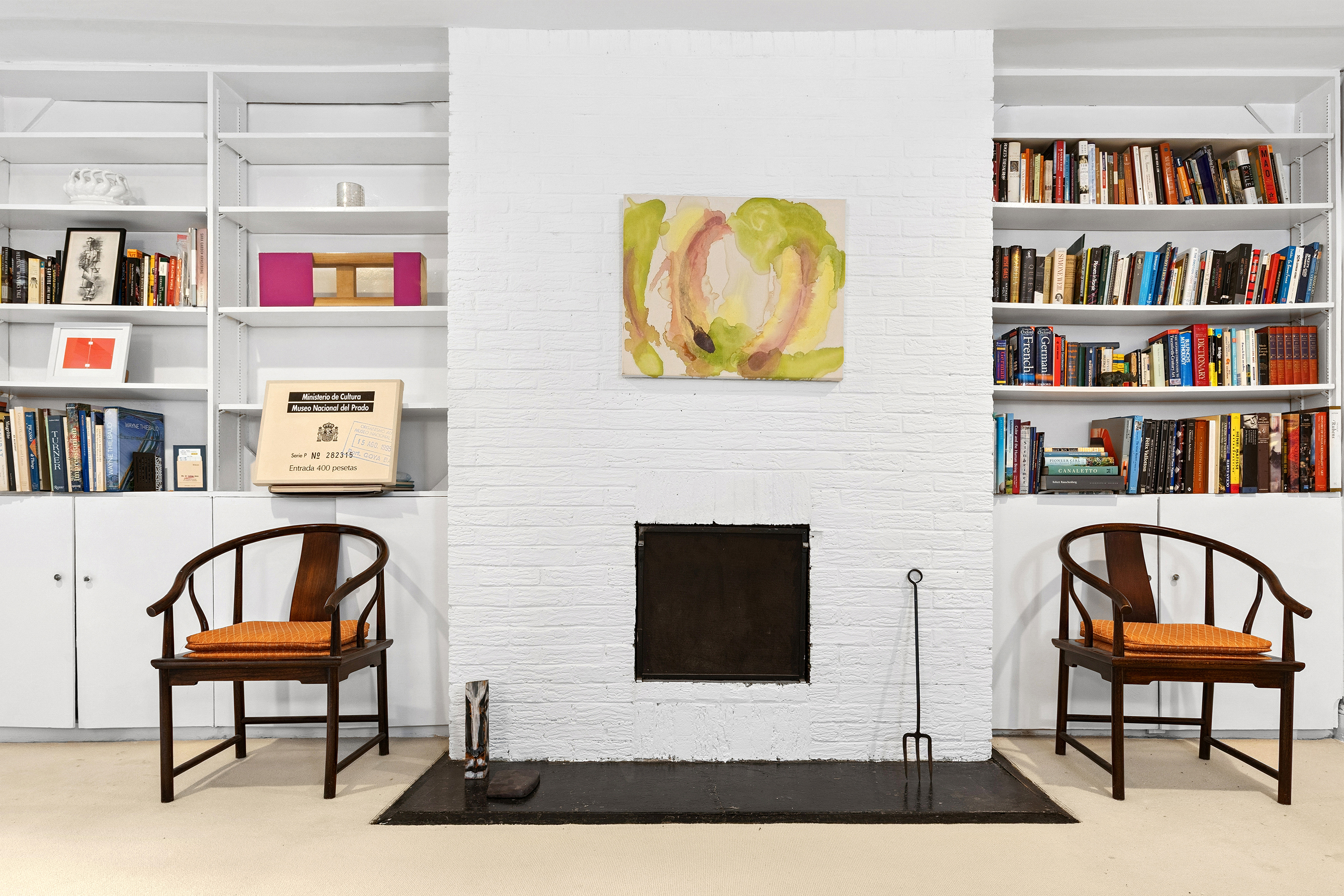 50 East 83rd Street, Unit 1R Manhattan, NY 10028 - Photo 1 of 12 a living room with fish tank and a bookshelf