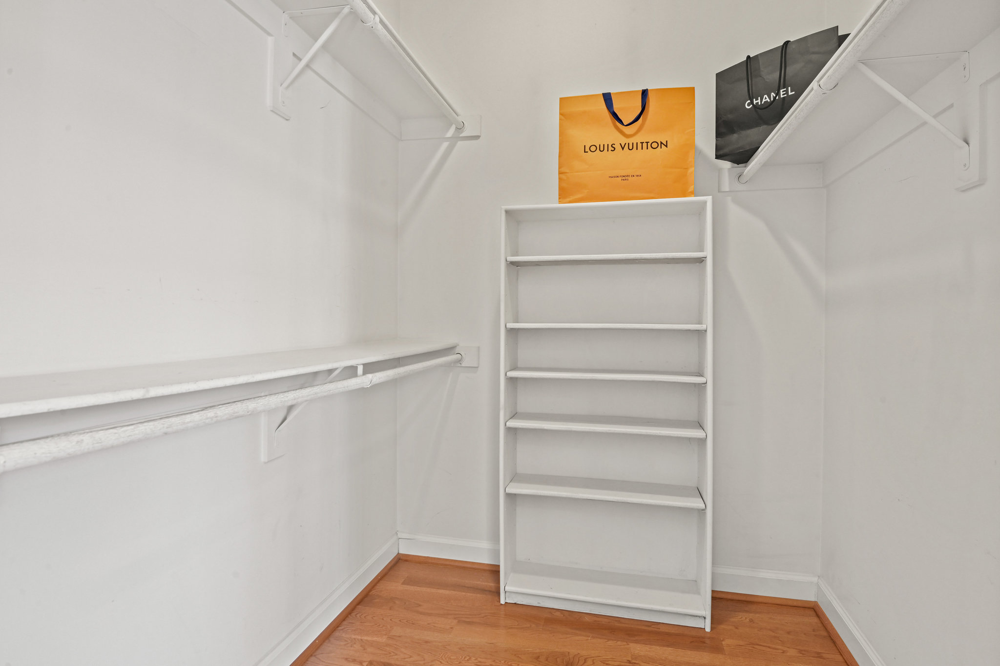 2628 Five Oaks Road Vienna, VA 22181 - Photo 26 of 40 a view of walk in closet with empty racks