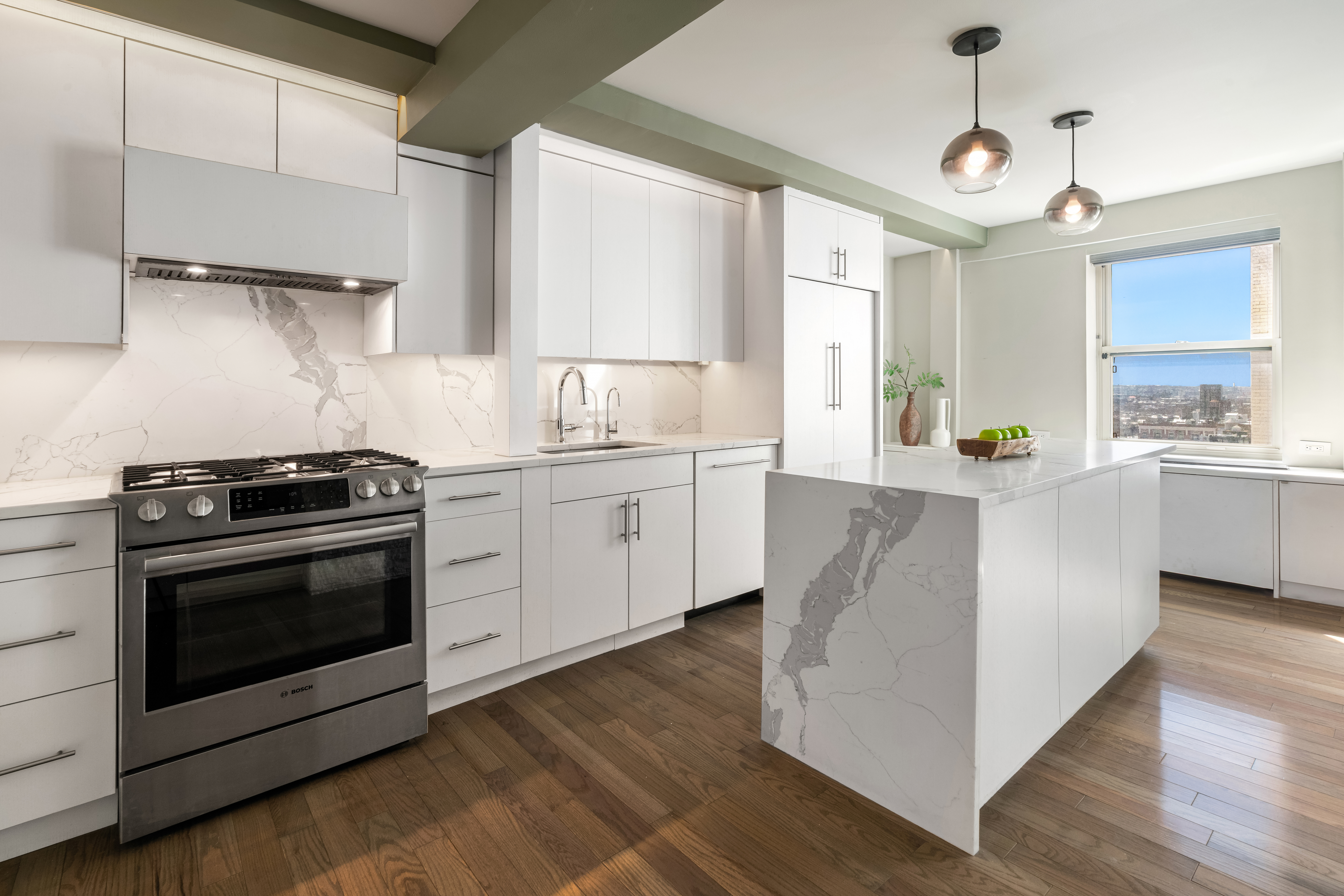 111 Hicks Street, Unit 16LM Brooklyn, NY 11201 - Photo 3 of 16 a kitchen with stainless steel appliances a white stove top oven cabinets and a wooden floor