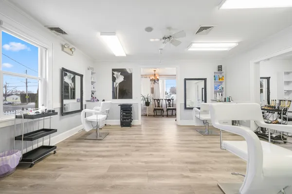 a living room with fireplace furniture and view of living room