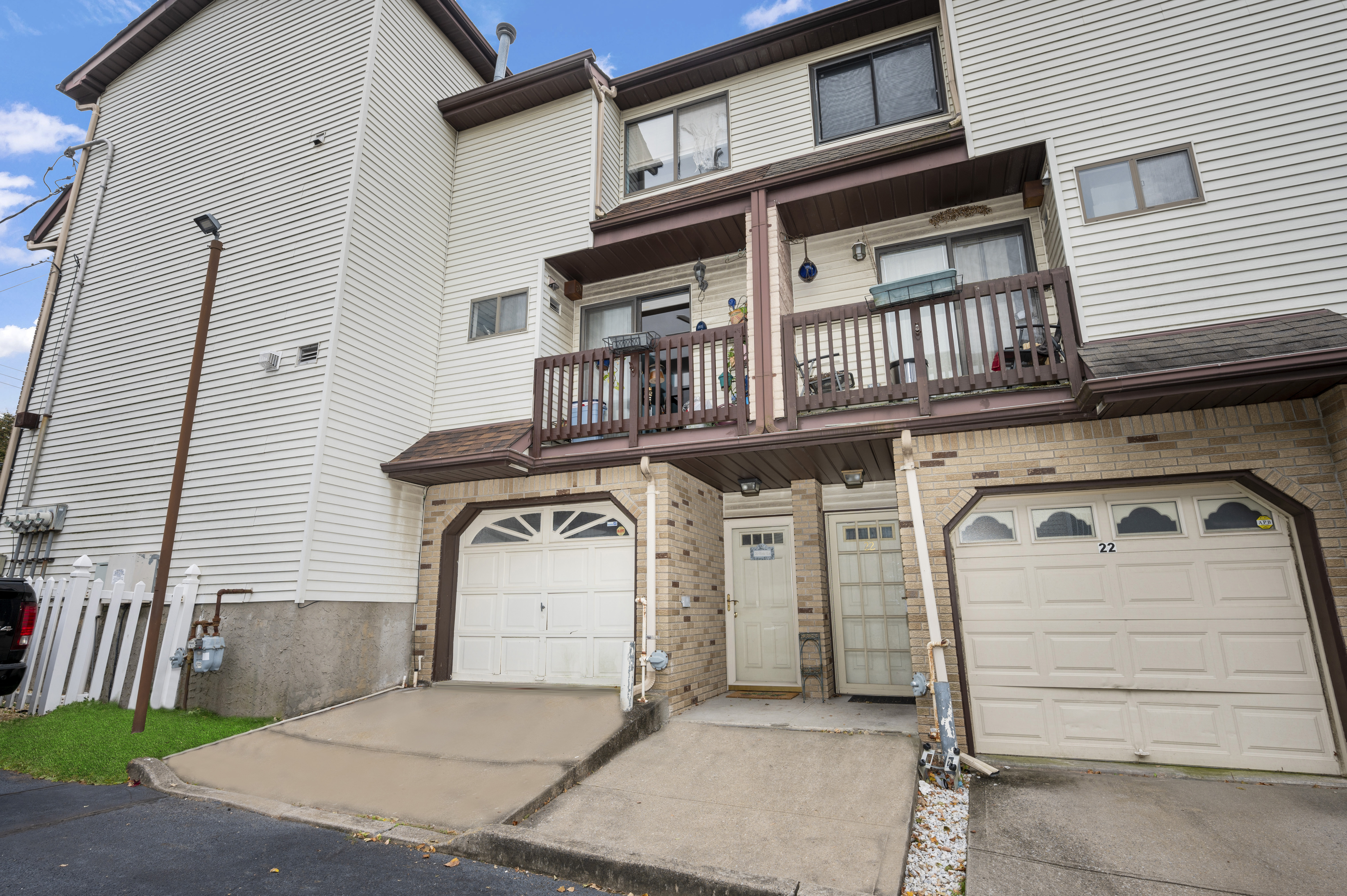 20 Eric Lane Staten Island, NY 10308 - Photo 3 of 20 a front view of a house with a garage