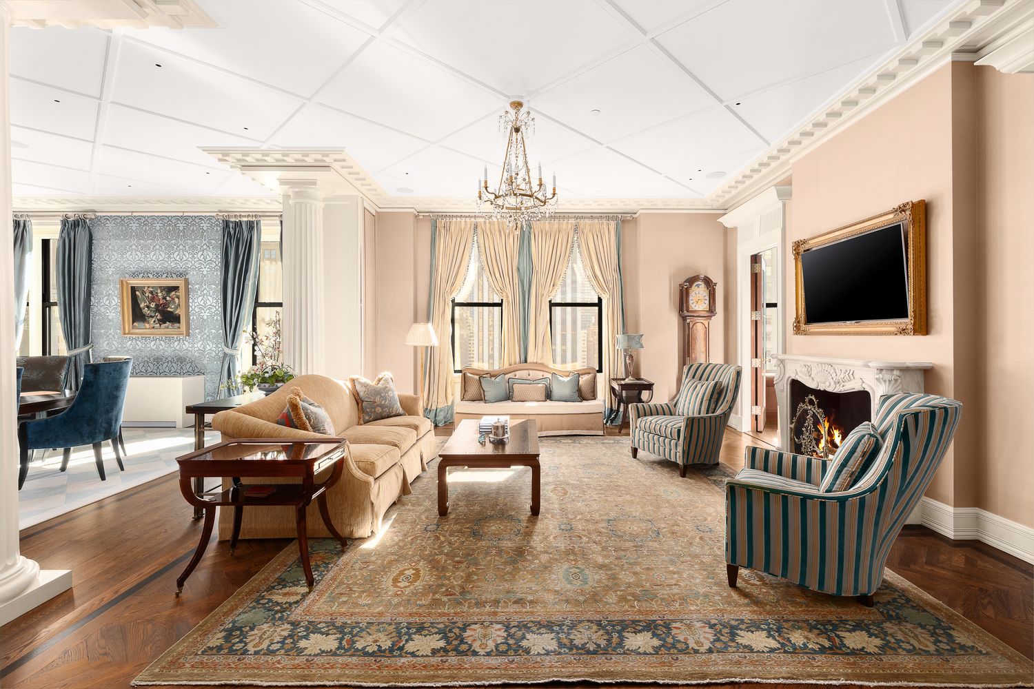 a living room with fireplace furniture and a flat screen tv