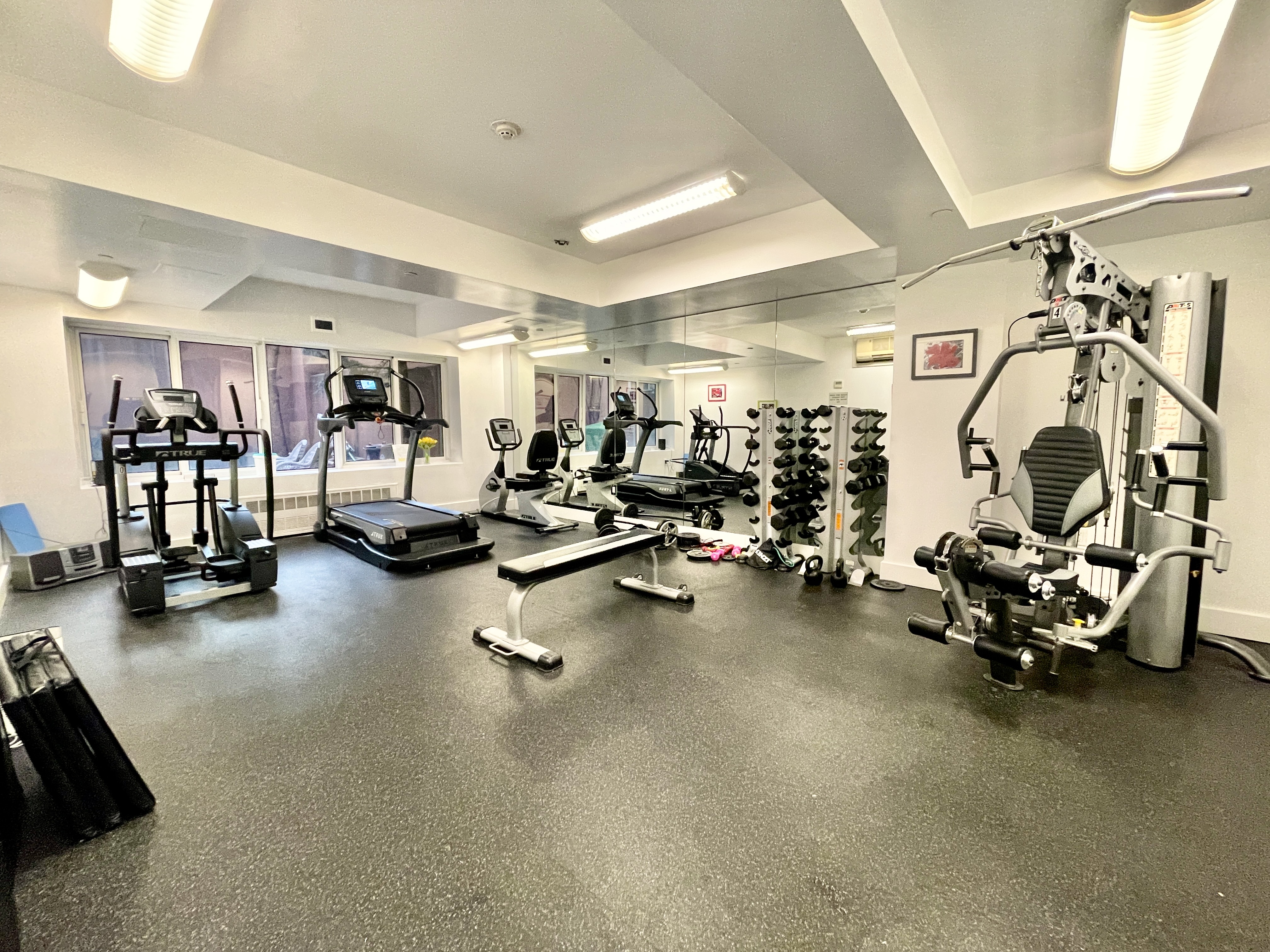 106 West 116th Street, Unit 12A Manhattan, NY 10026 - Photo 10 of 13 a view of a room with gym equipment