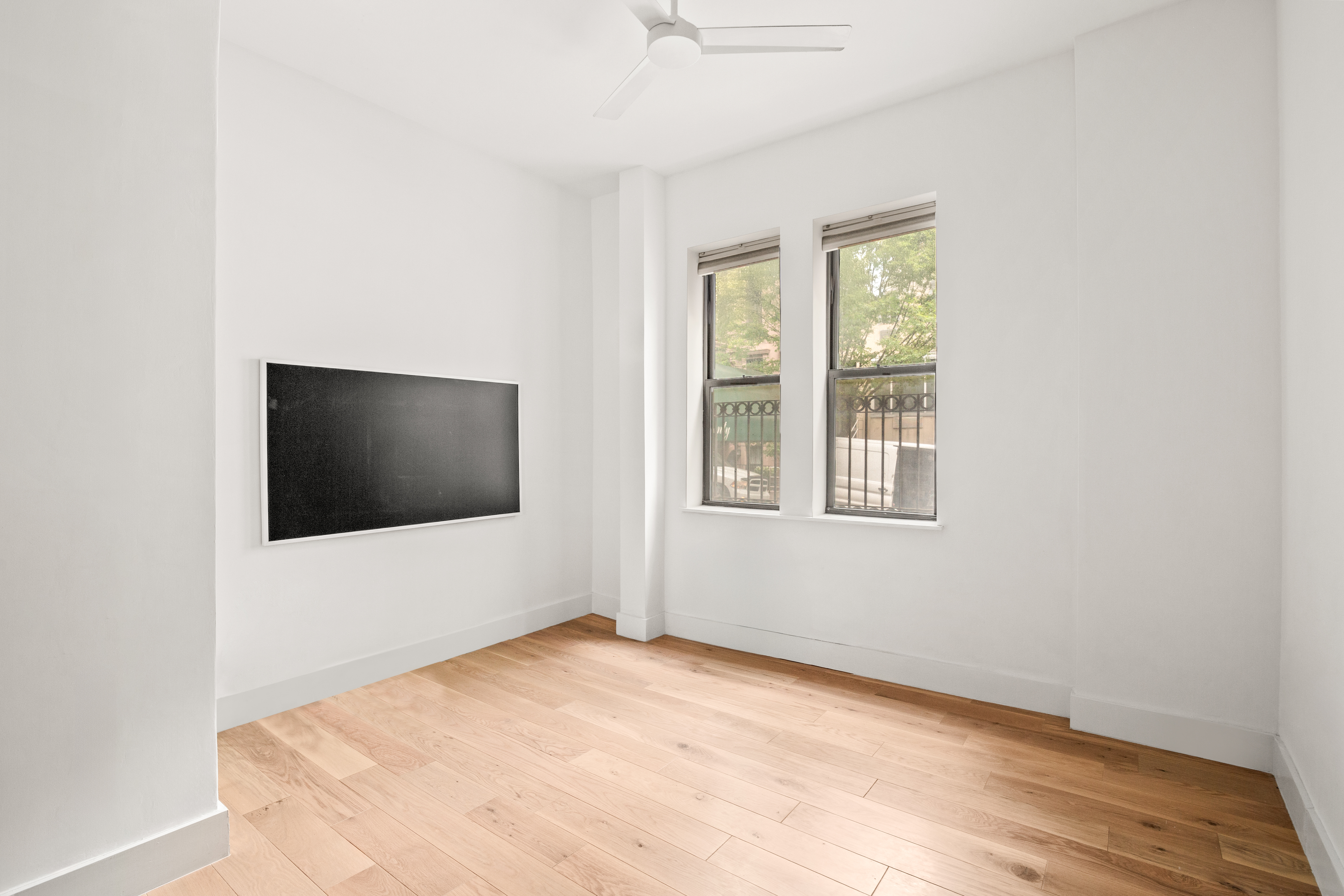 170 East 94th Street, Unit 1C Manhattan, NY 10128 - Photo 3 of 9 a workspace with a flat screen tv