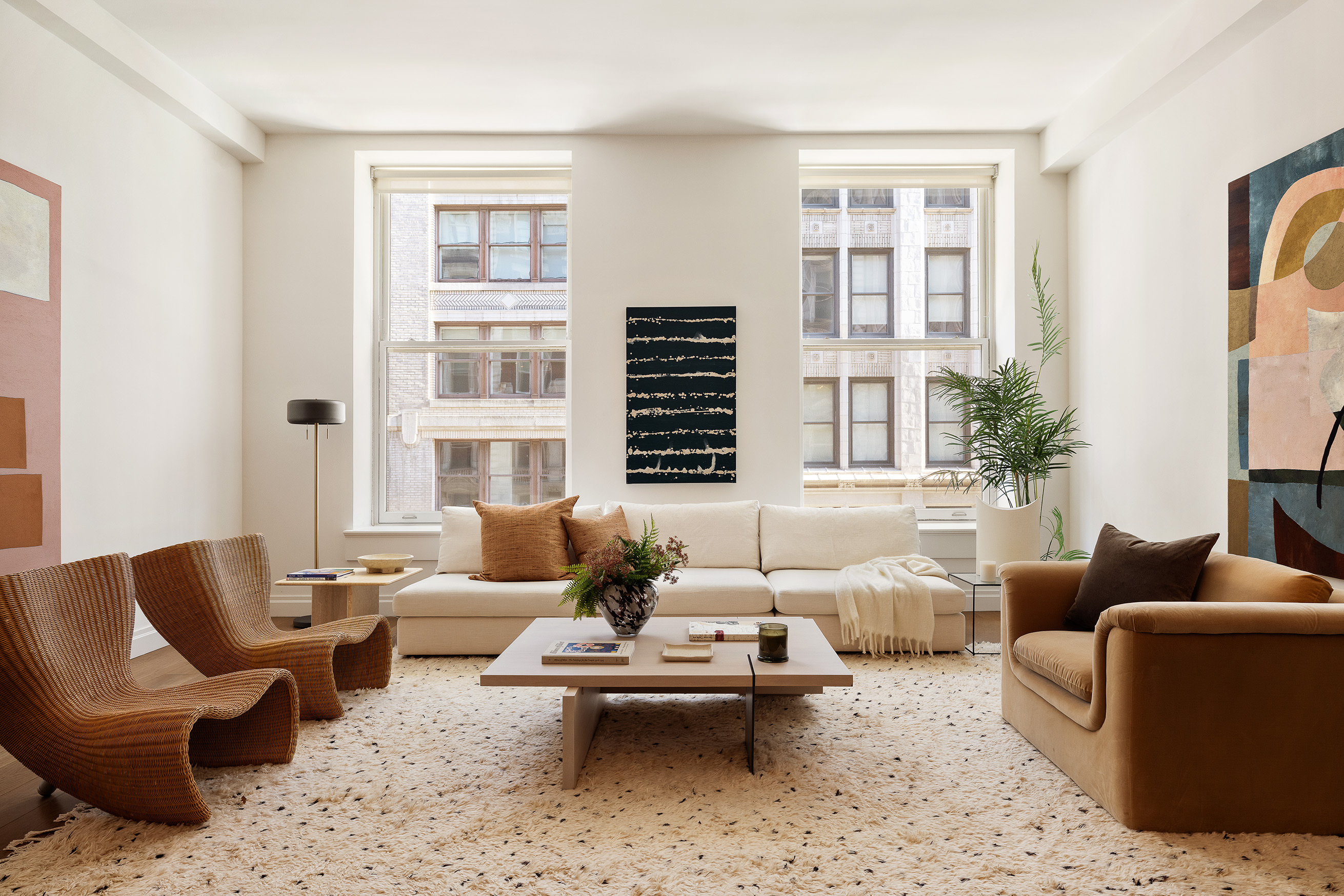 42 East 20th Street, Unit 4AD Manhattan, NY 10003 - Photo 2 of 19 a living room with furniture wooden floor and a large window