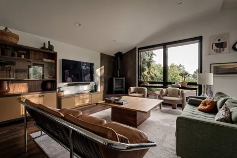 a living room with furniture and a large window